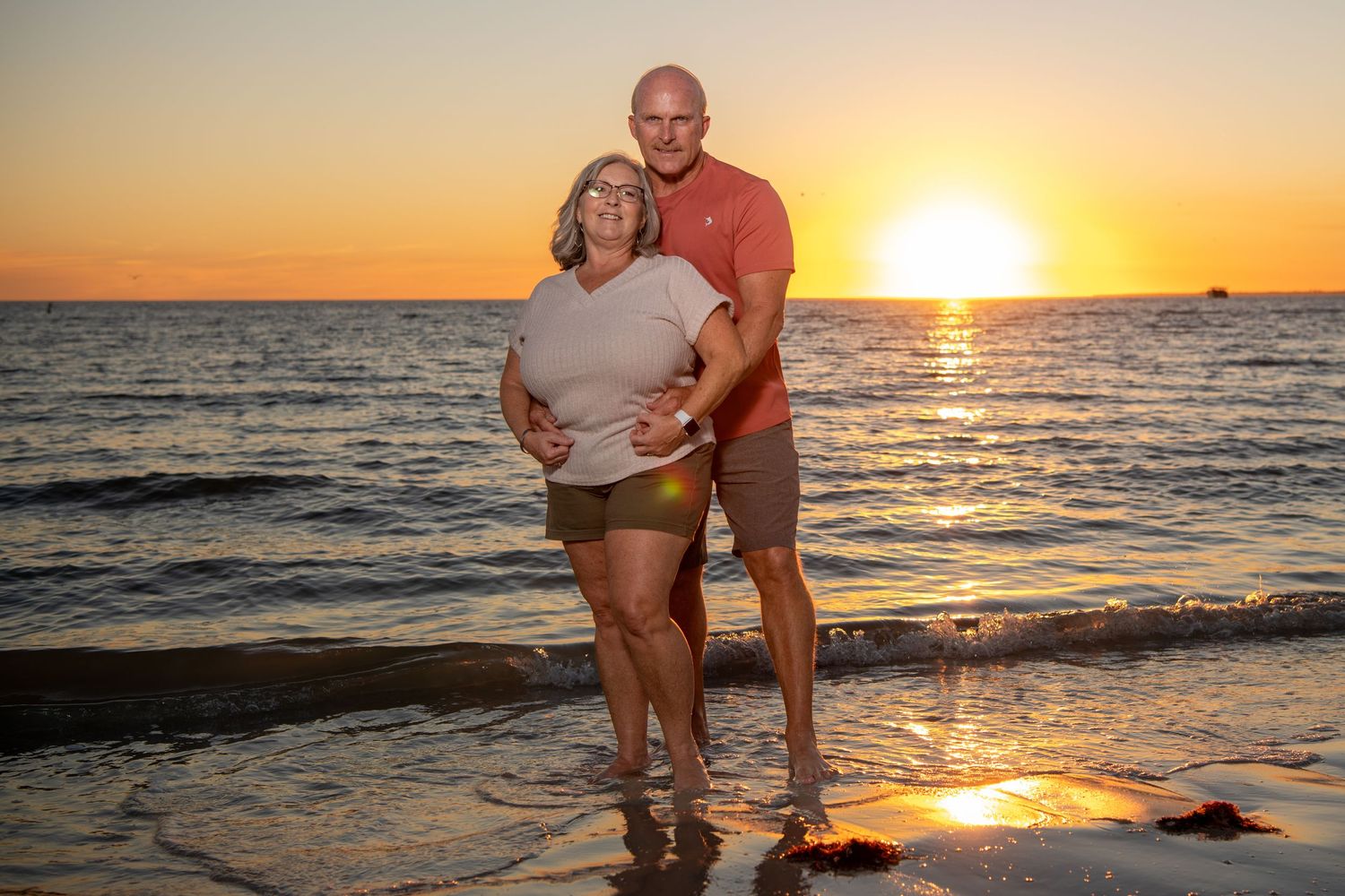 Series of sunset beach photos showing couple walking along shoreline. Couples photoshoot.