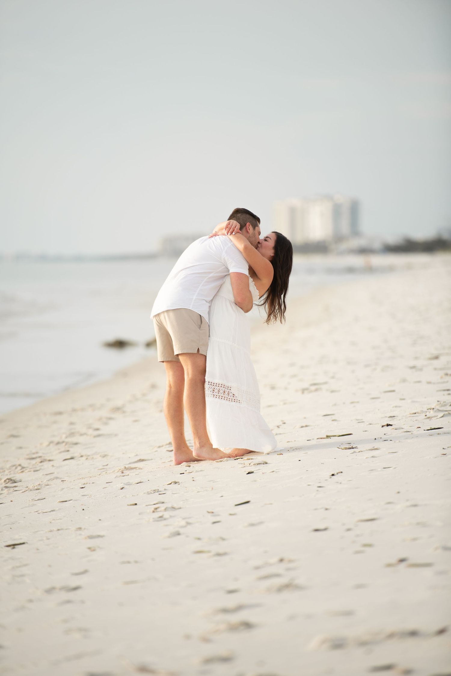 Playful beach photography session with soft dreamy lighting.