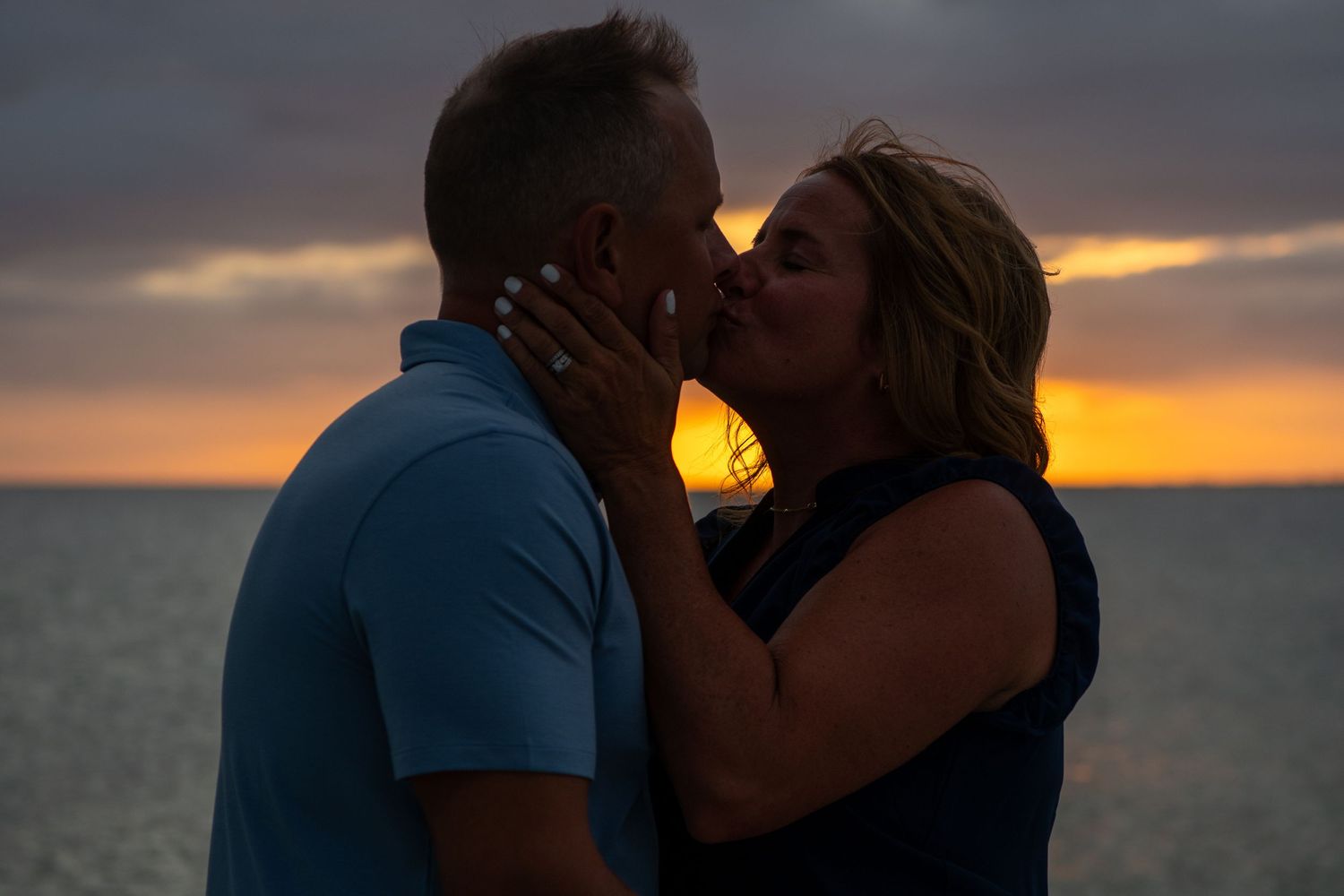 Romantic beach sunset silhouettes with dramatic cloudy sky. Beach photoshoot. Family photoshoot,