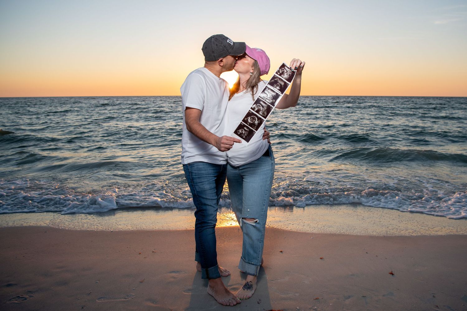 Beach maternity photography session with couple at golden hour. Maternity photoshoot. Couples photos.