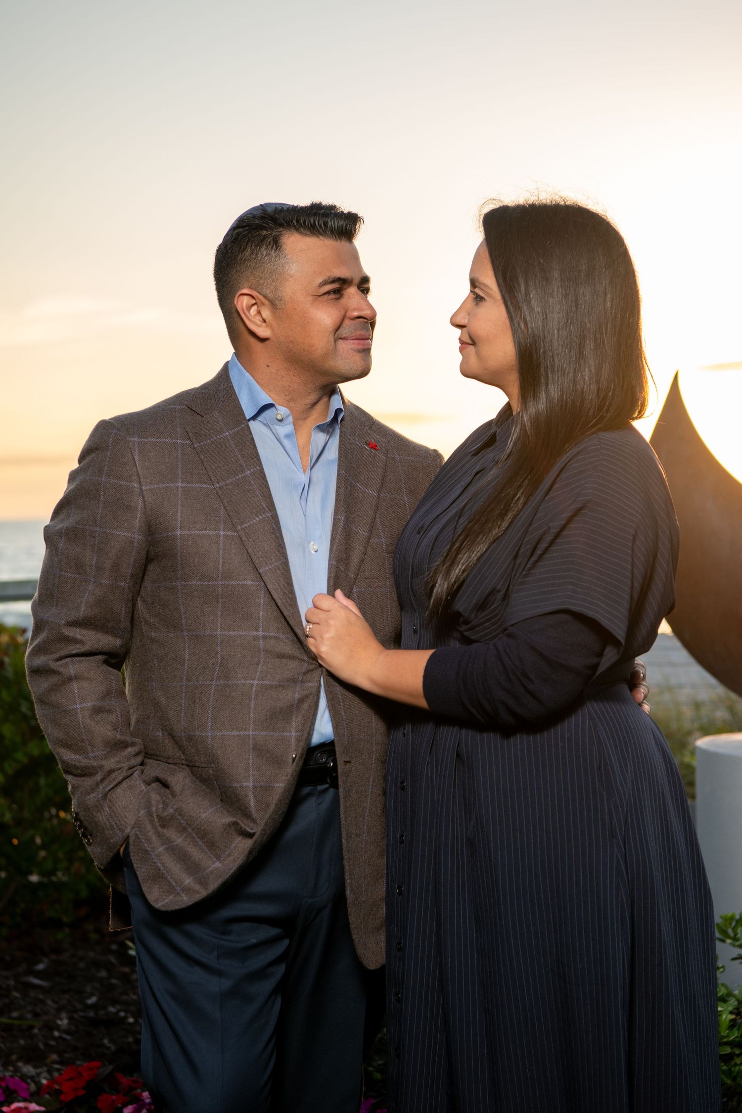 Intimate couple photos showing playful interactions during a sunset photoshoot. Family photoshoot.