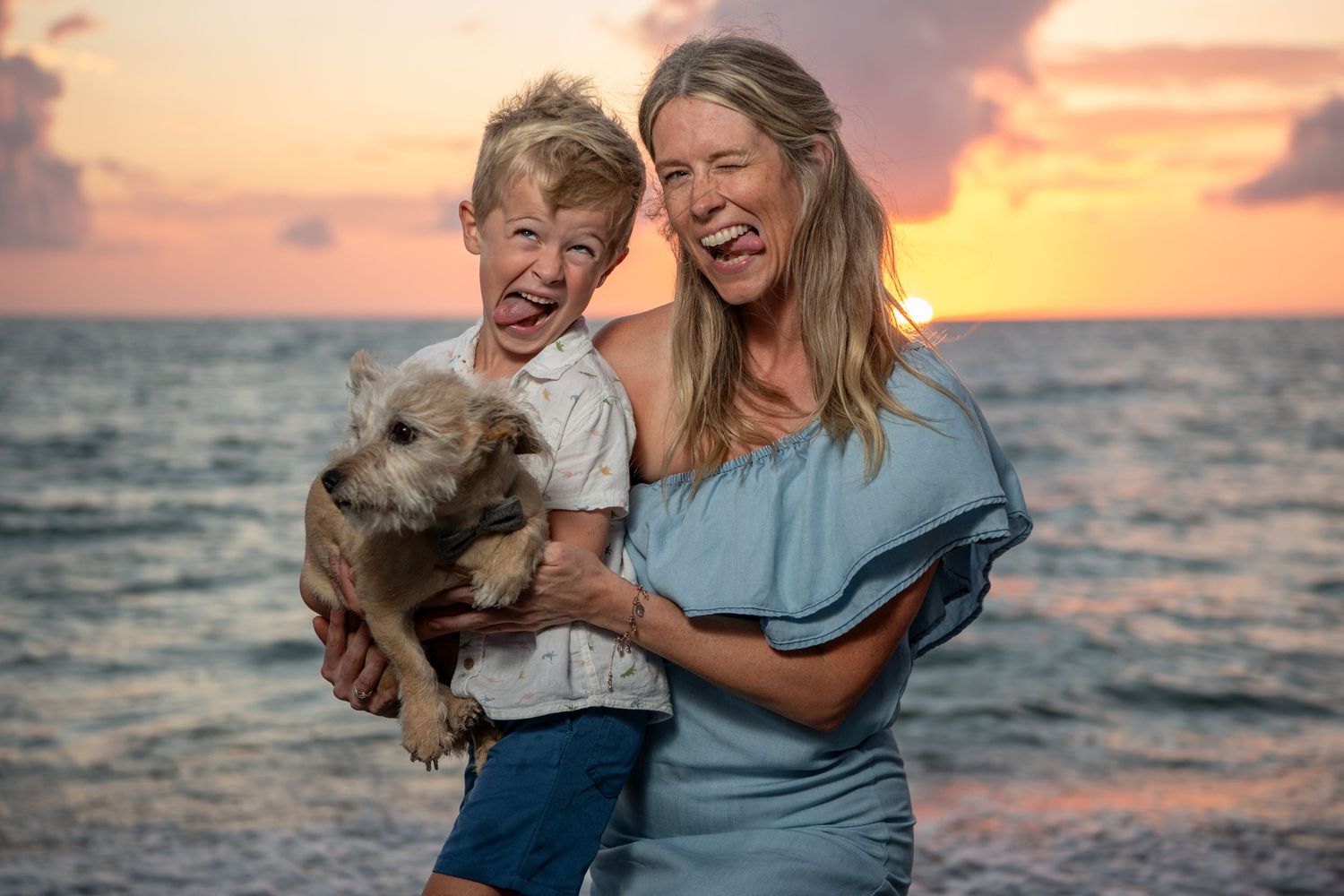 Heartwarming beach photoshoot at sunset with playful moments by the ocean. Beach photoshoot. Family photoshoot,