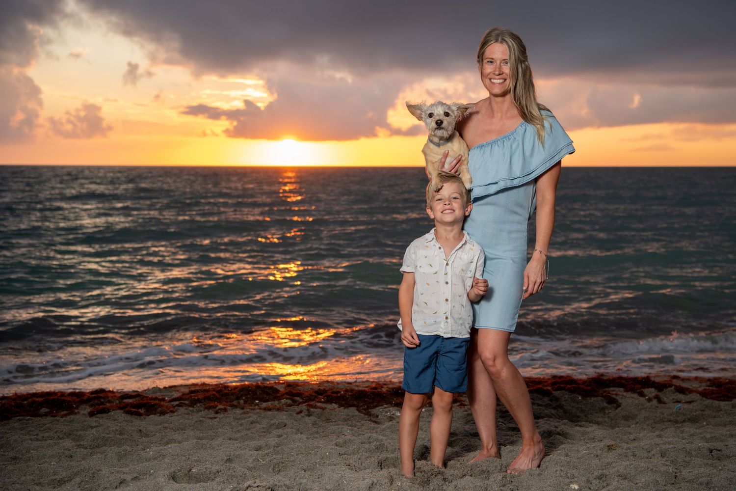 Mother and child share tender moments during a sunset beach photoshoot. Beach photoshoot. Family photoshoot,