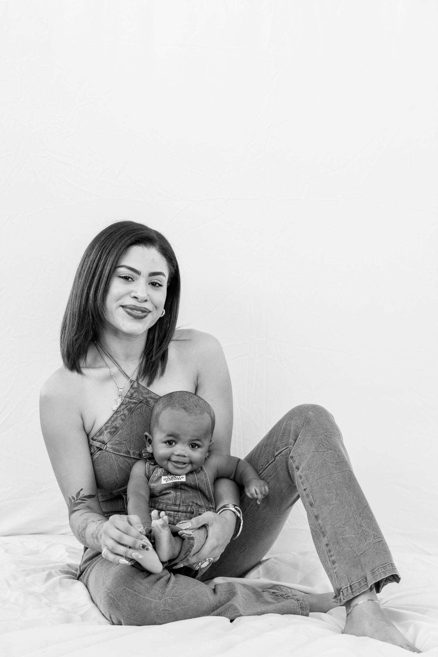 Black and white studio photography session on white background.