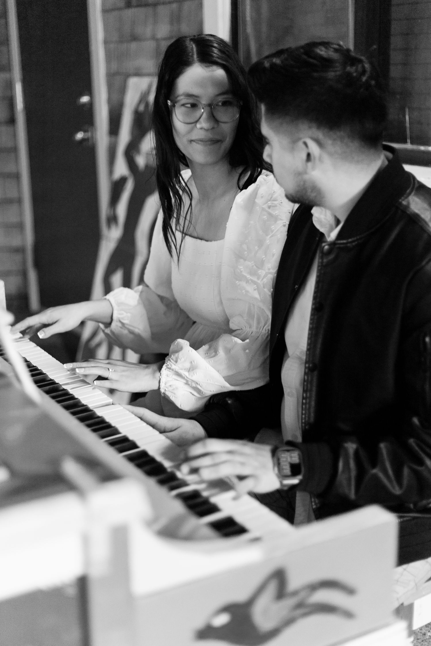 Couple playing piano at UC Davis Arboretum photo session with Sophia Juarez Photography
