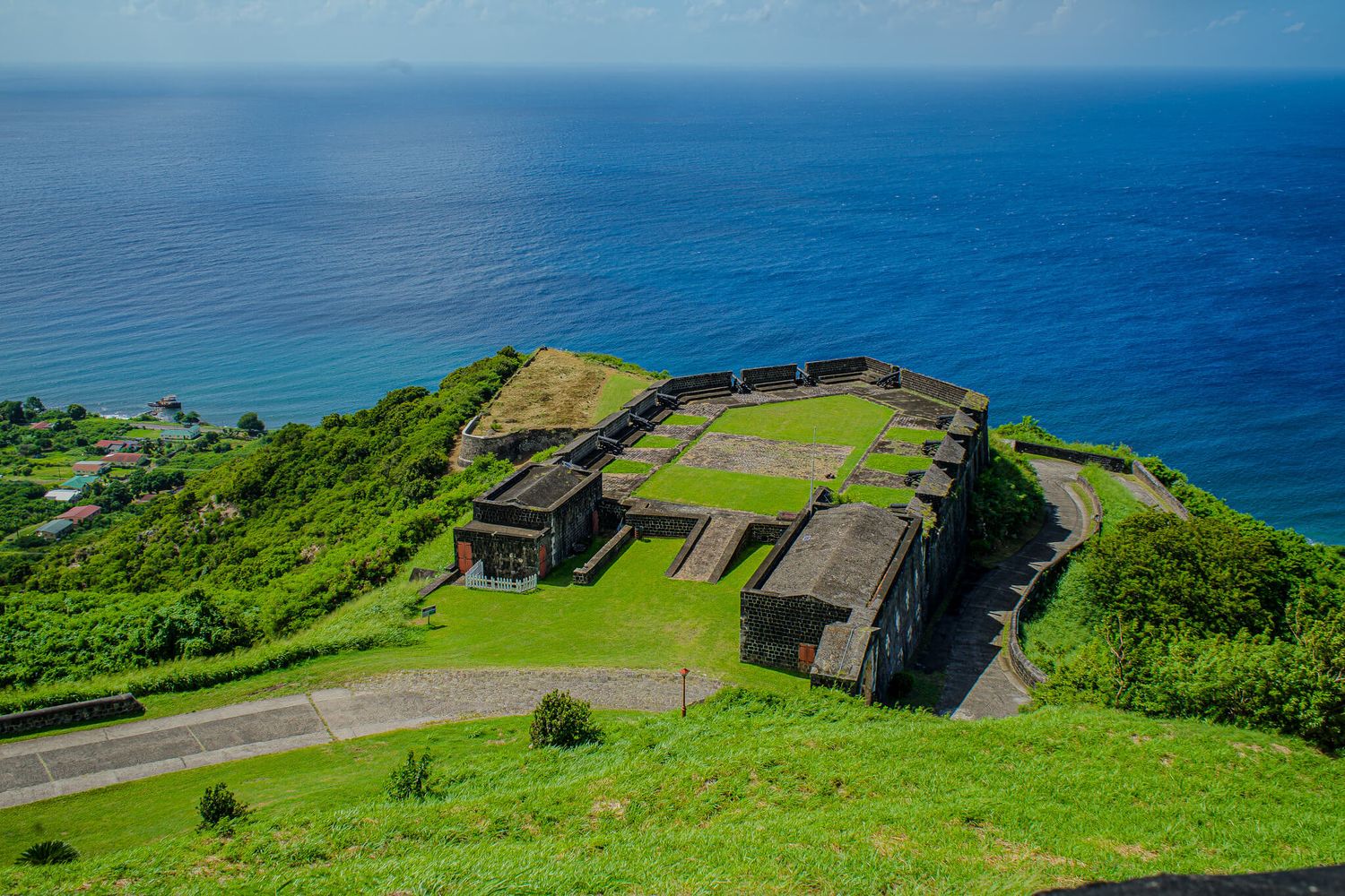 Historic military fortification overlooking blue Caribbean waters at Brimstone Hill Fortress in St. Kitts.