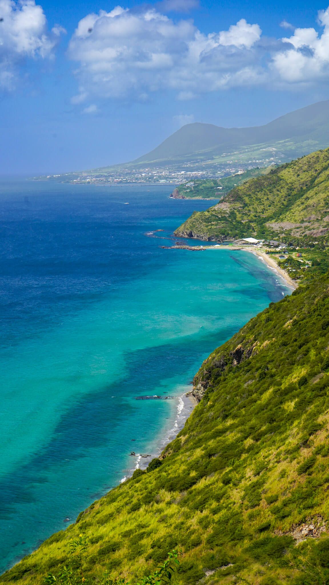 Stunning aerial view of the turquoise St. Kitts coastline. Stop here on the best St. Kitts Tours with St. Kitts Cruise Photography.