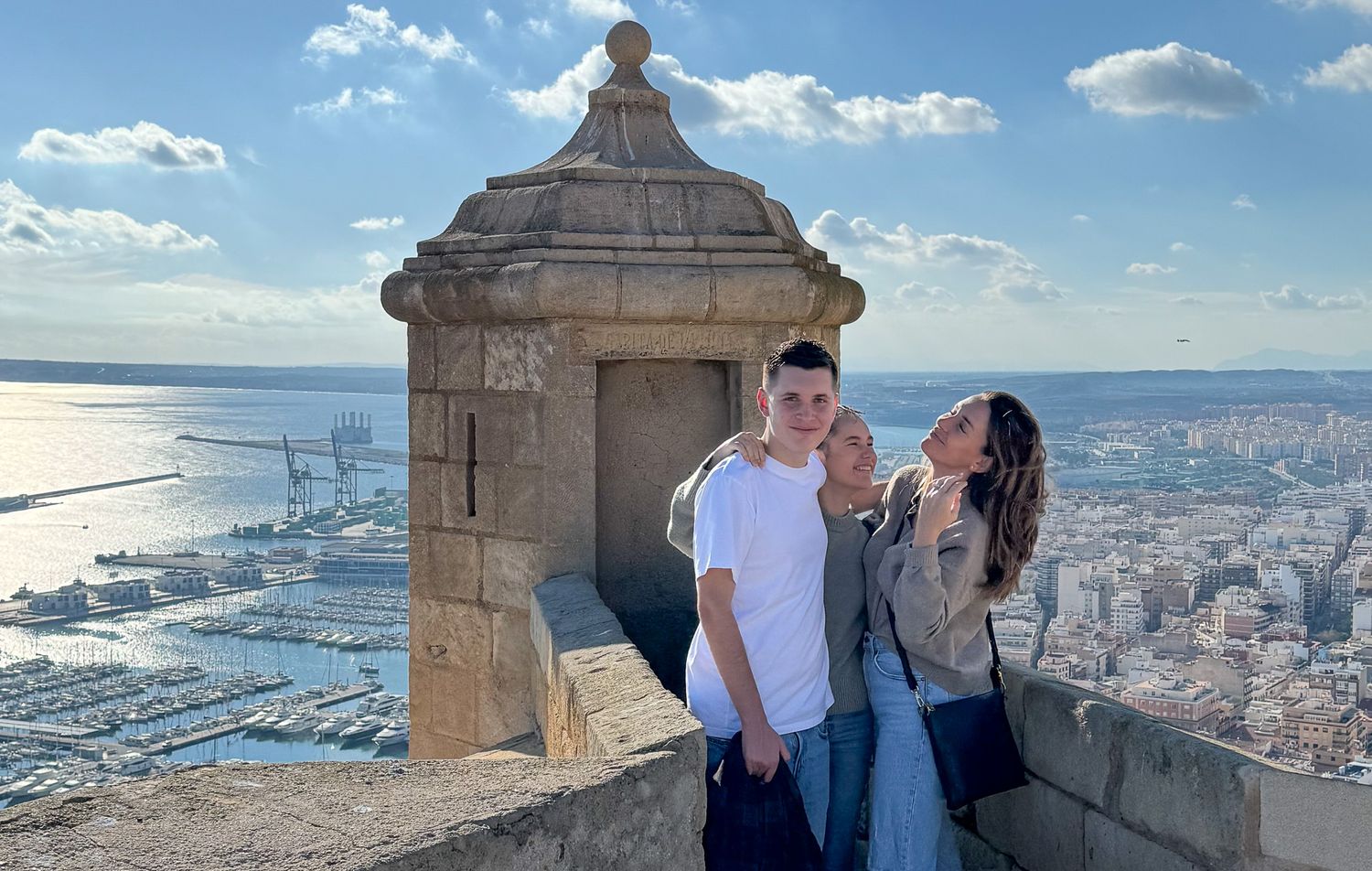 Historic stone fortress overlooking a scenic coastal city vista.