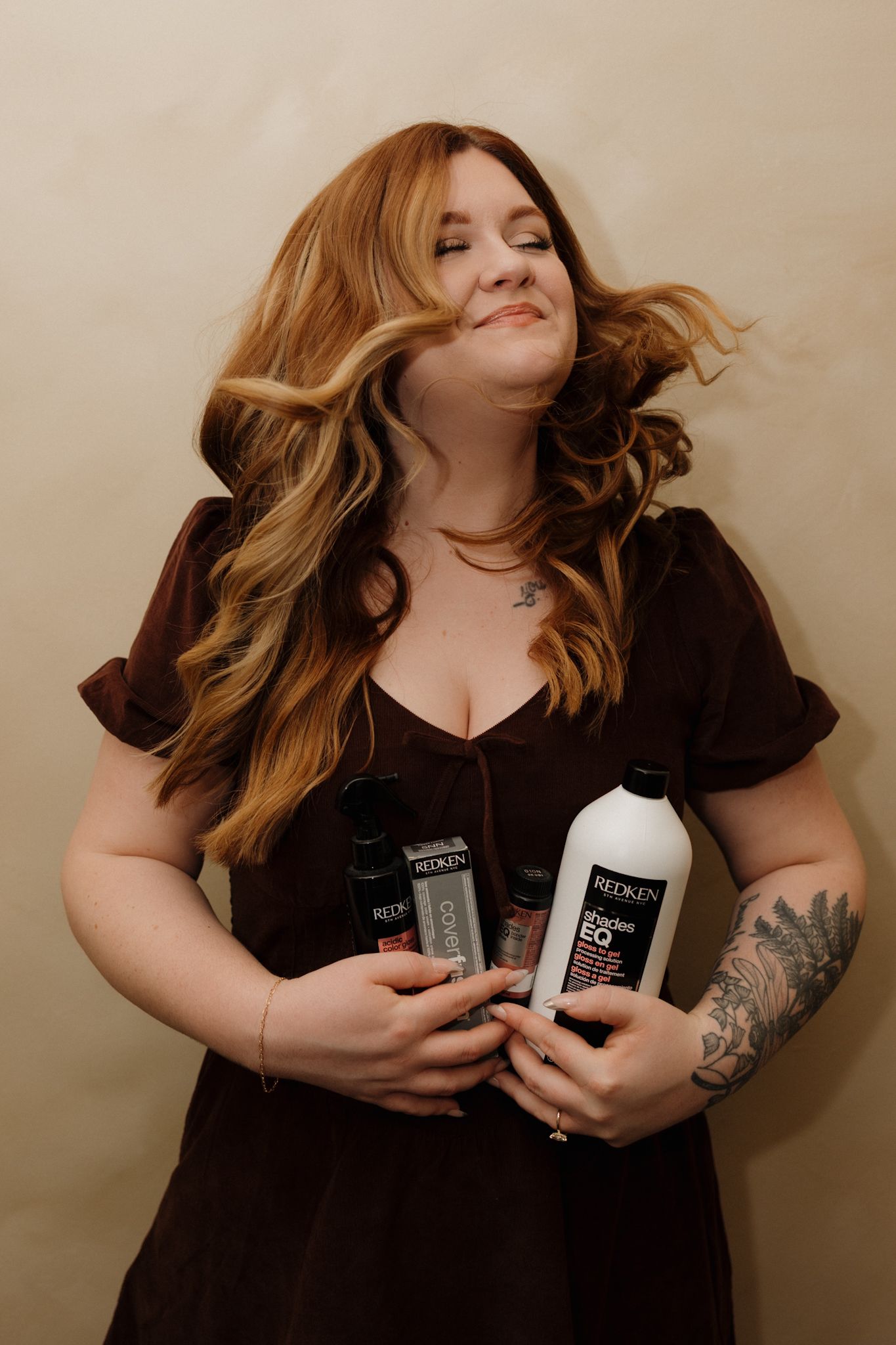 A series of five artistic portrait photos showing someone in a dark top posing with hair products against a neutral backdrop.