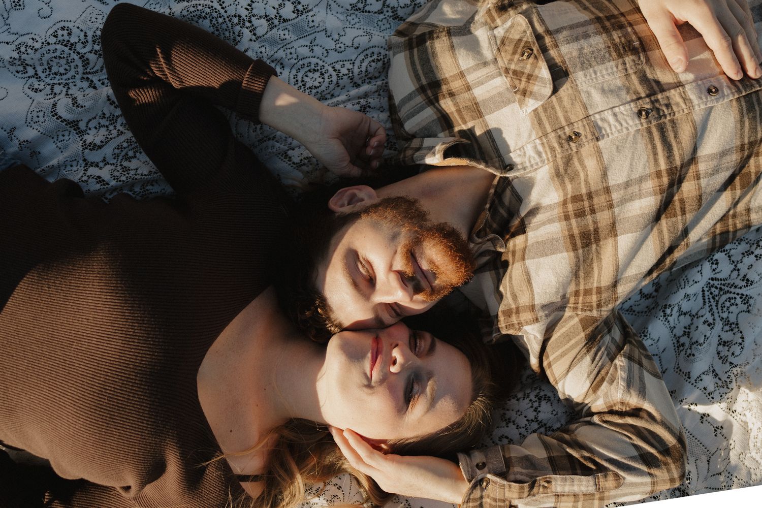 A sequence of intimate close-up portraits showing a couple lying down against one another.