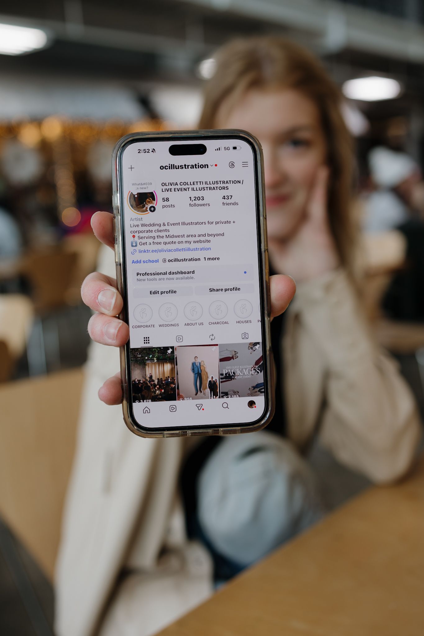 Person scrolling through social media feed on smartphone screen showing various posts and interface elements.