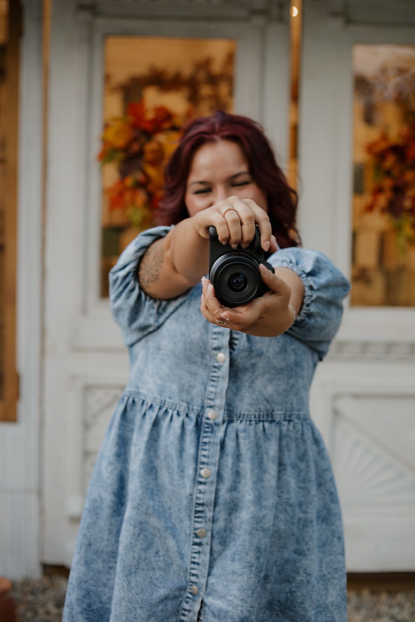 A photographer wearing a denim dress holds up a camera in a series of connected photos on a porch.