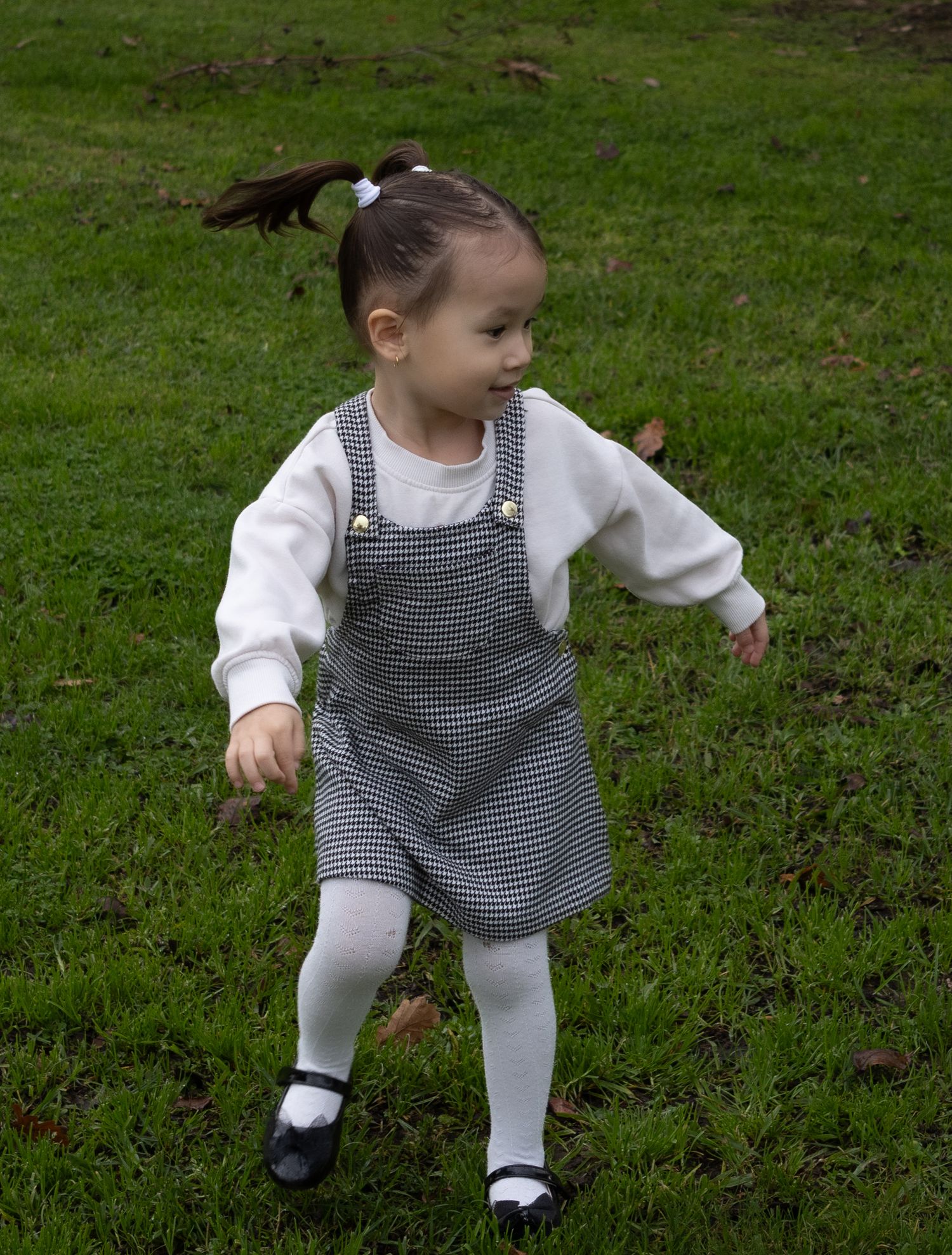 Young girl running during a family photography session in Albury.