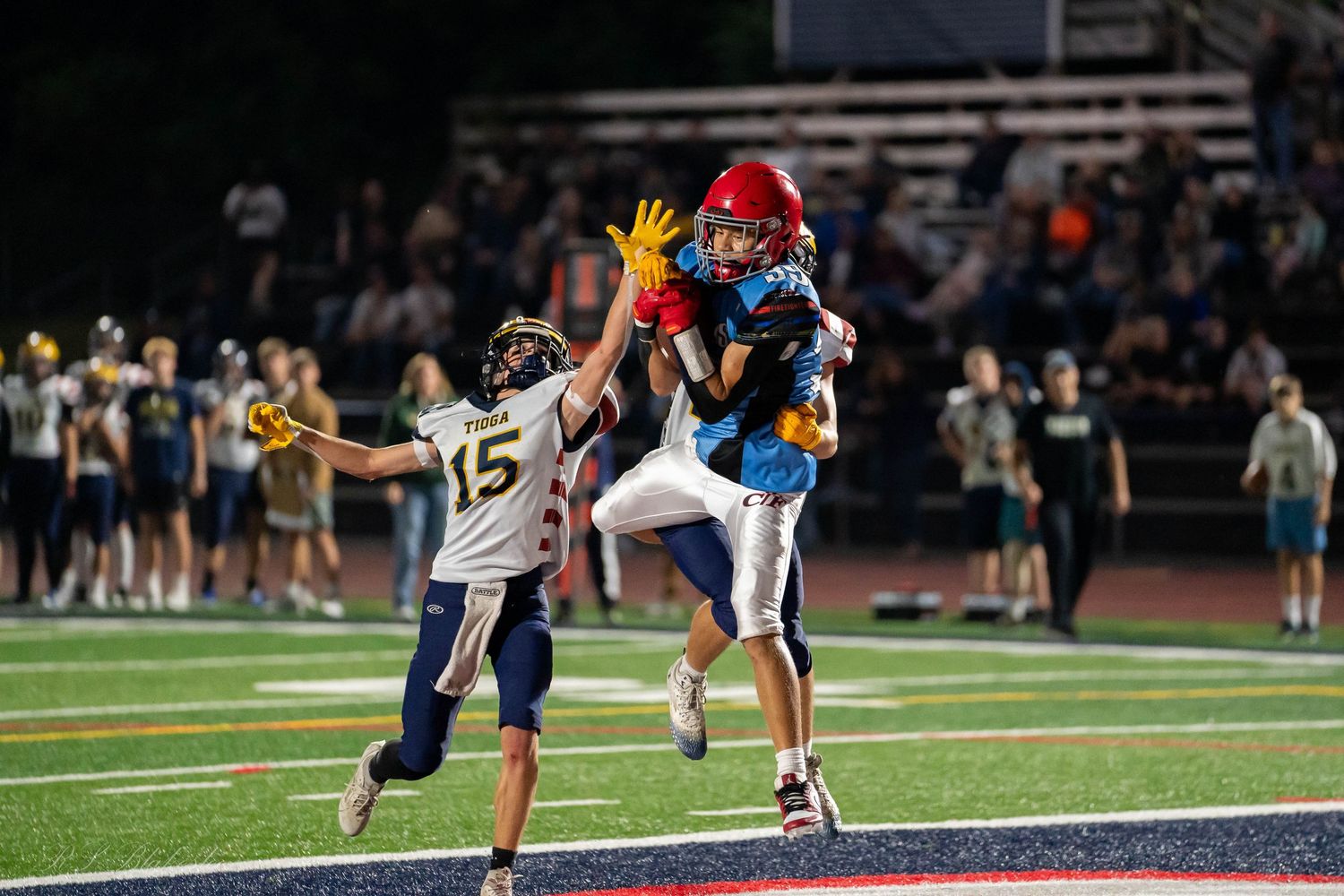 High school football player makes a touchdown catch during a Section IV varsity football game in New York.