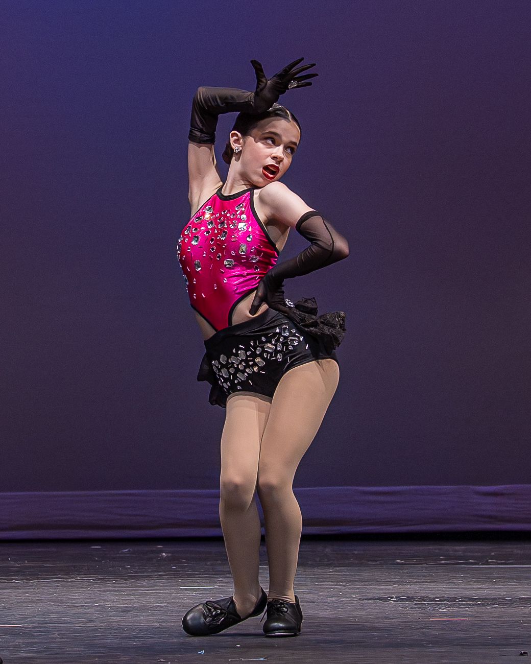 Competitive dance solo performance photographed on stage during a regional dance competition in New York.