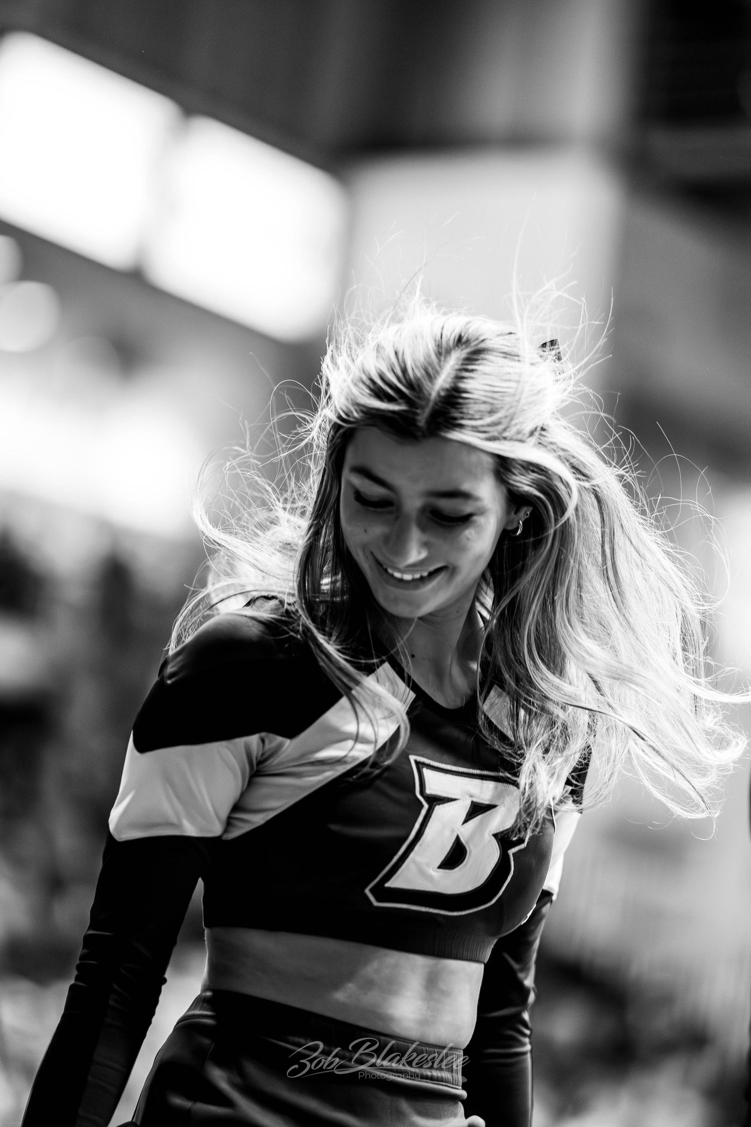 black and white division 1 binghamton university cheerleader smiling