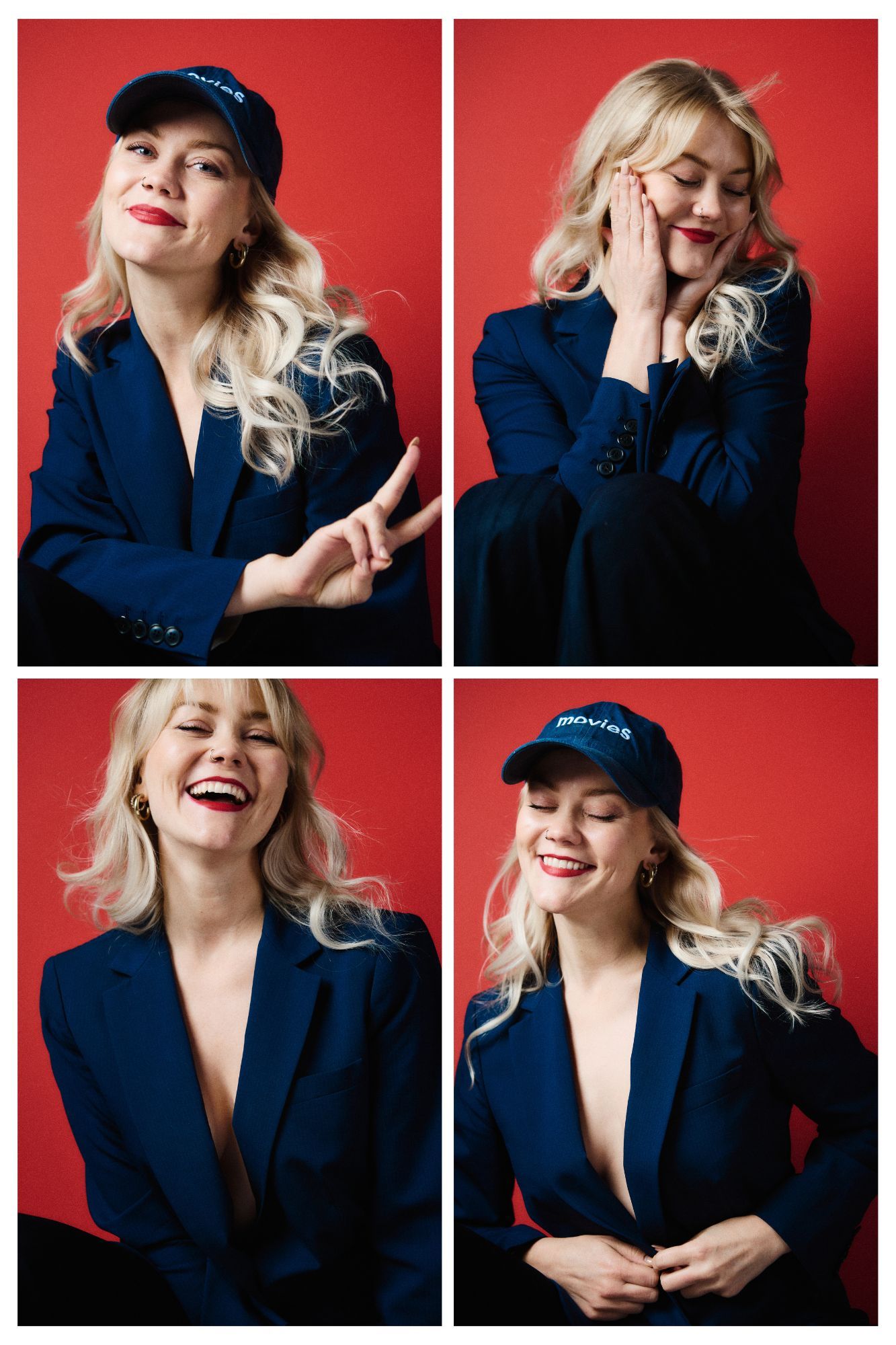 Blonde woman in navy blazer and cap poses in four fun expressions against a bold red studio background.