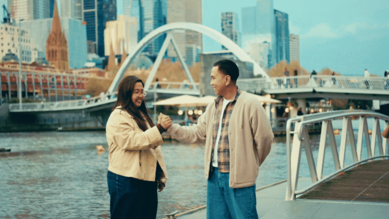 Couple doing their unique signature handshake.