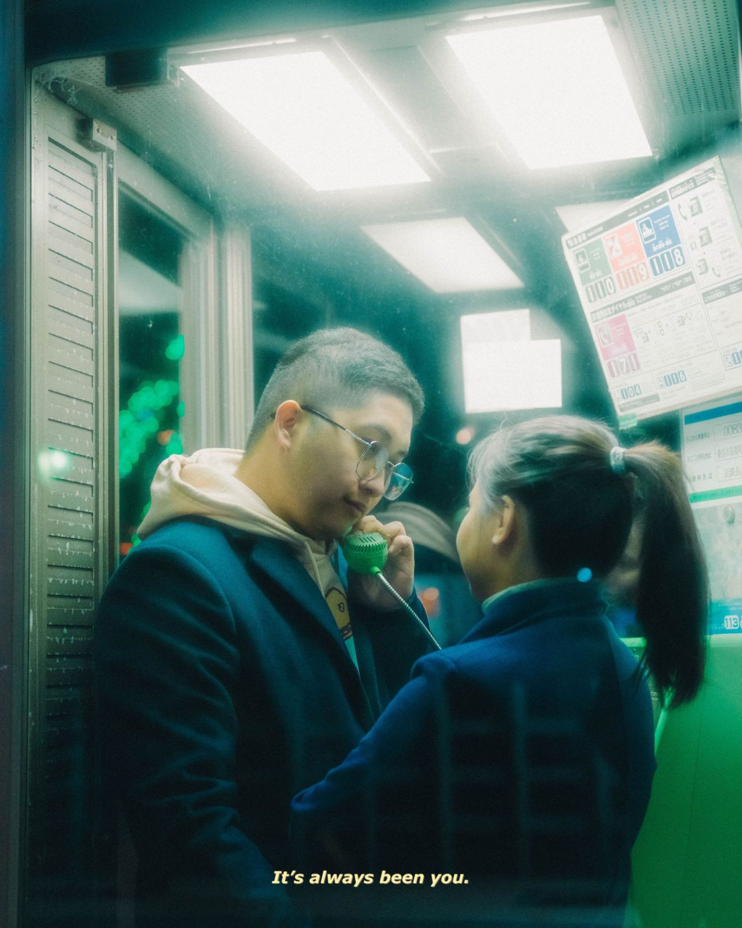 Young couple sharing an intimate moment in a brightly lit convenience store at night.