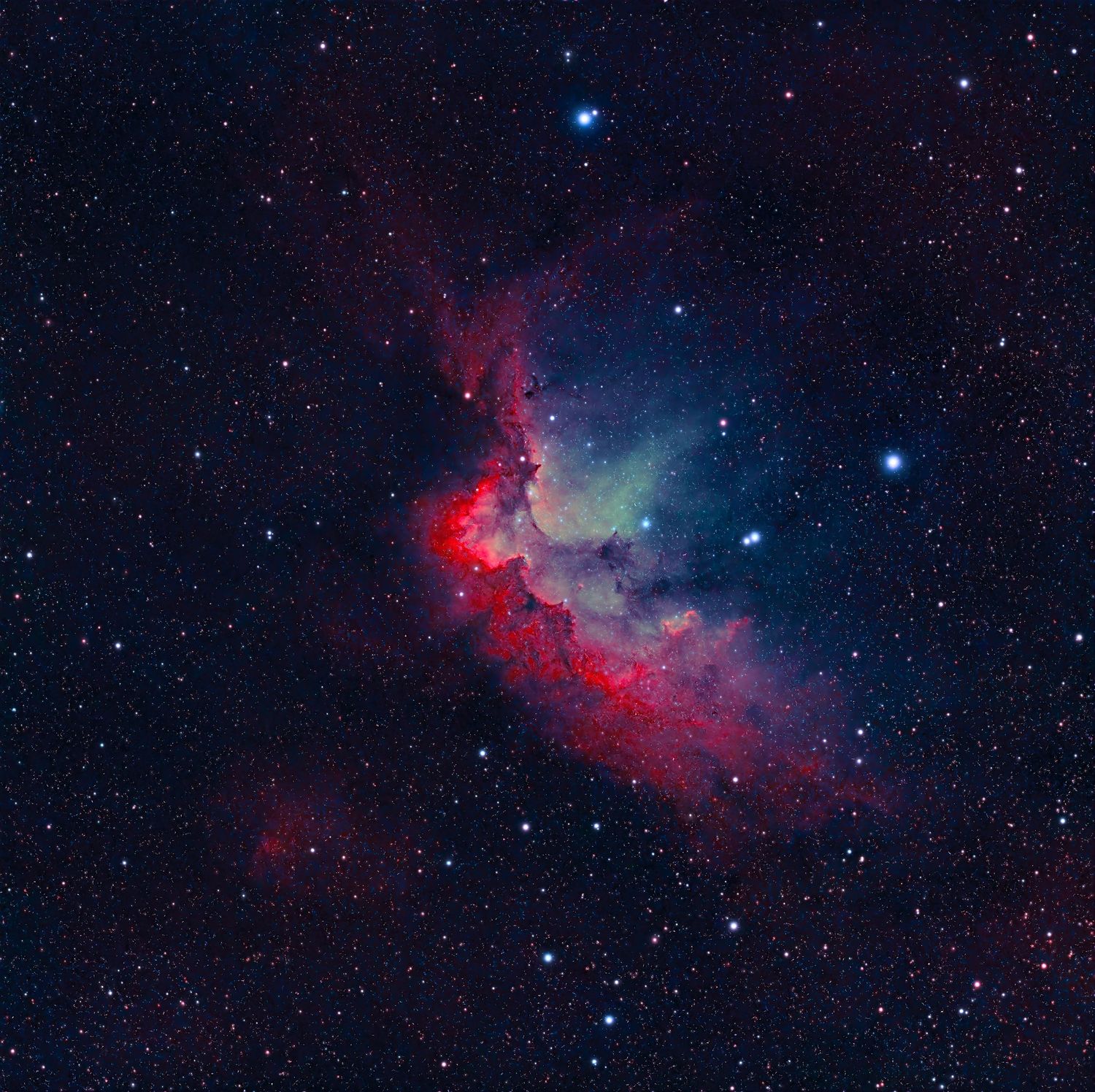 Colorful red and blue nebula with bright stars scattered across deep space in a stunning cosmic scene.
