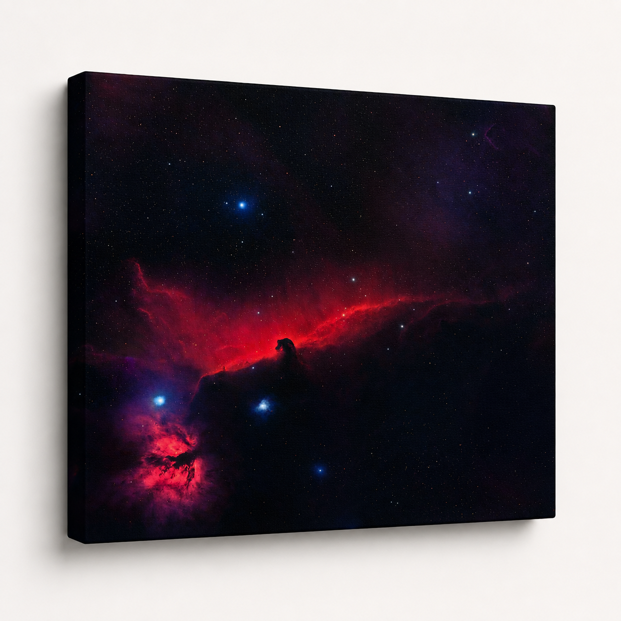 Canvas wall art of the Horsehead Nebula with vivid red and deep blue hues against a dark starry background.