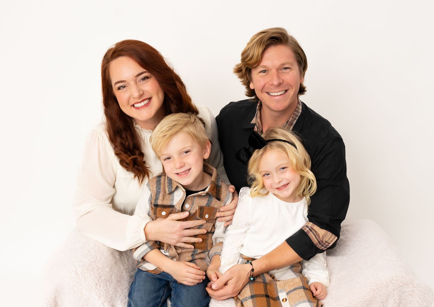 Sweet family lifestyle portrait session against white background showing connection and love.