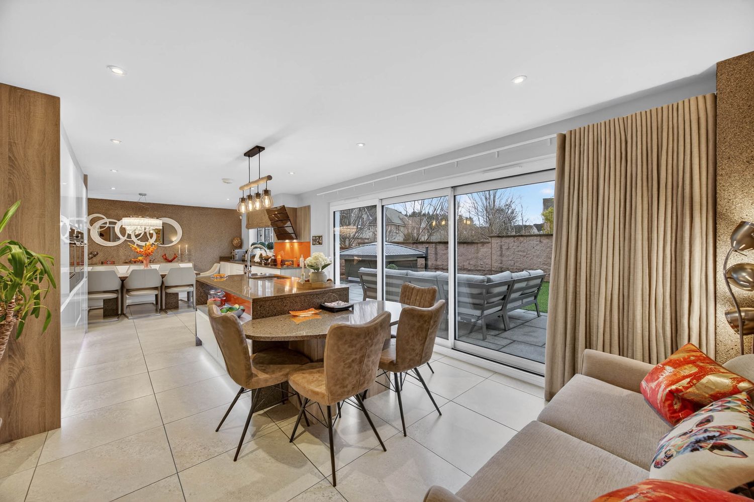 Stylish dining space with wooden accents, floor-to-ceiling windows, and contemporary furnishings.