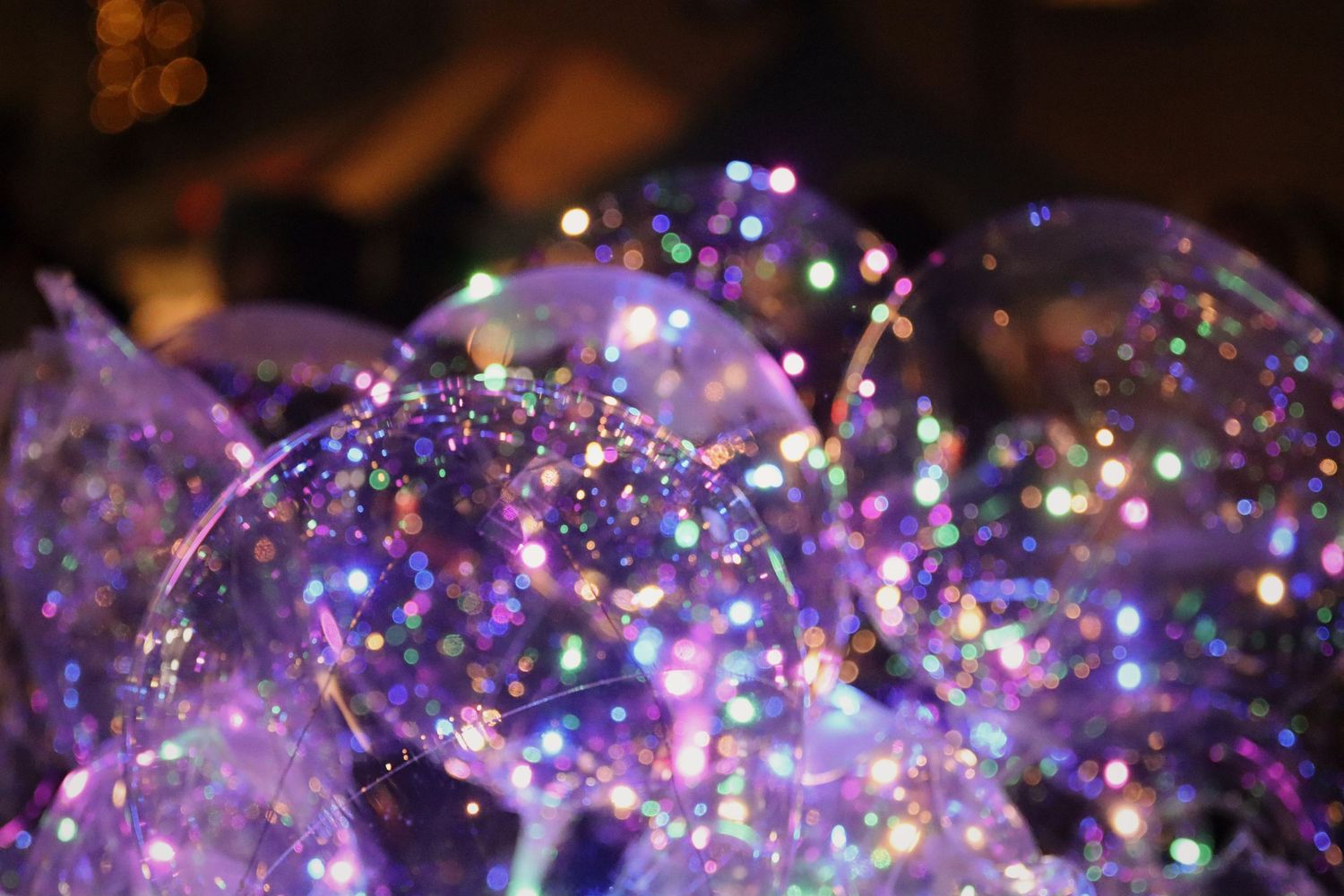 Balloons with fairy light on them.
