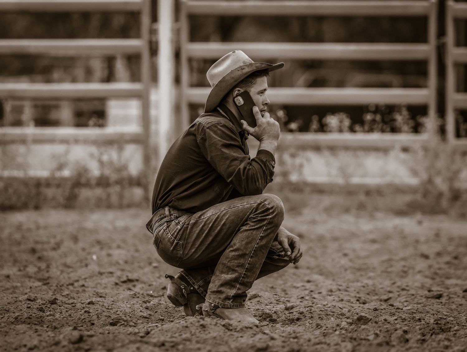 A sepia-toned sequence of images showing a person in a jacket crouching down in progressive motion.