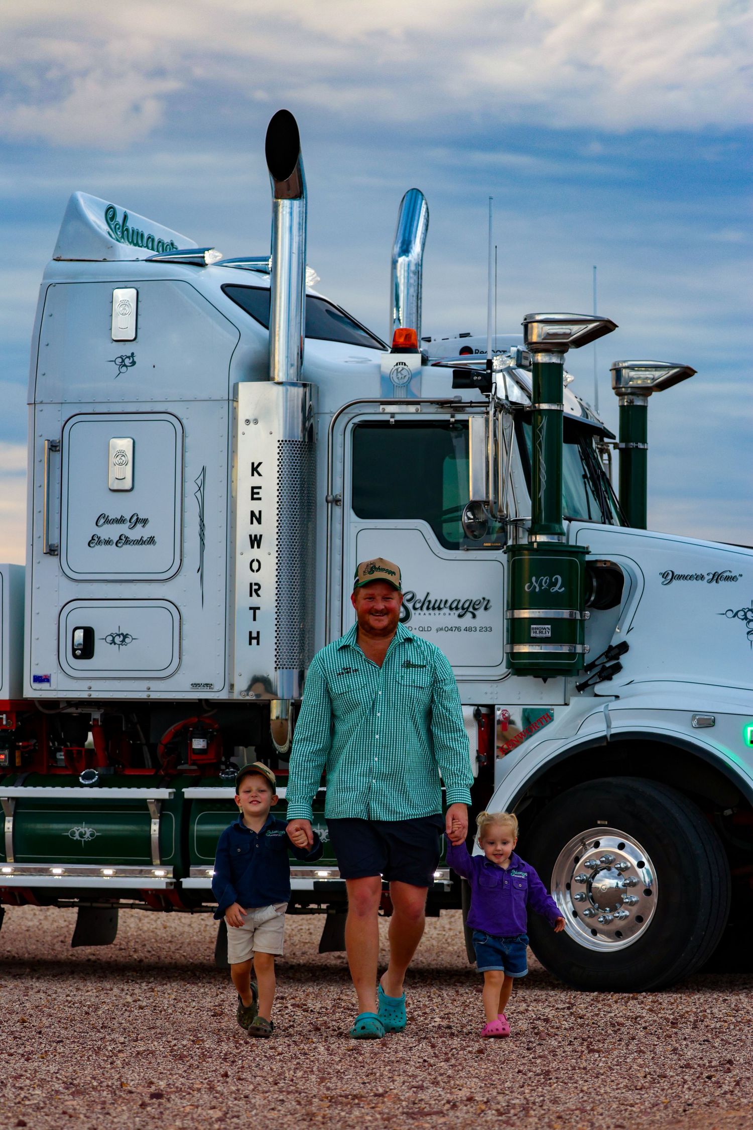 A sequence of four similar photos showing people standing next to large semi trucks parked on gravel terrain.