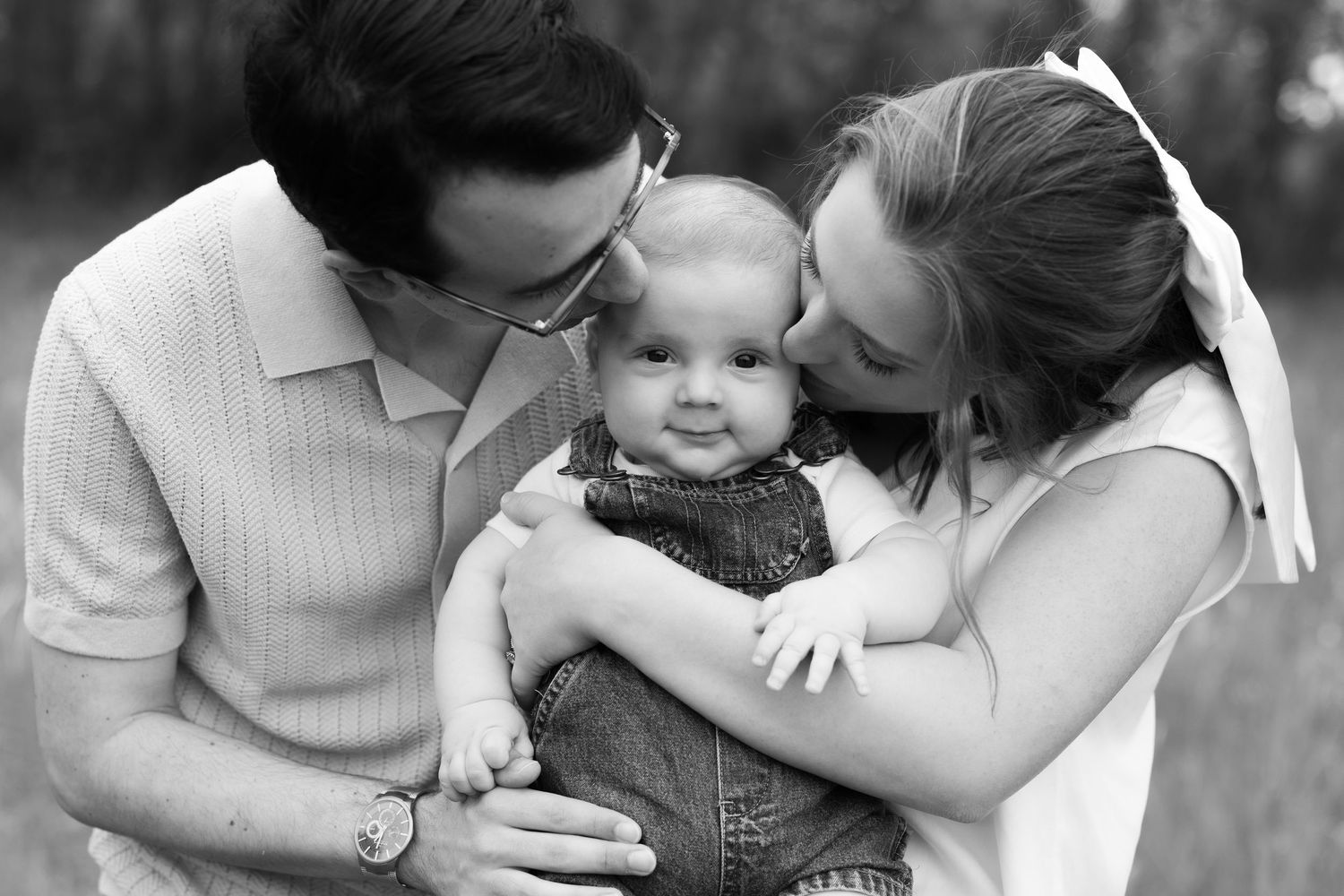 Black and white intimate family lifestyle portraits showing tender moments and embraces.