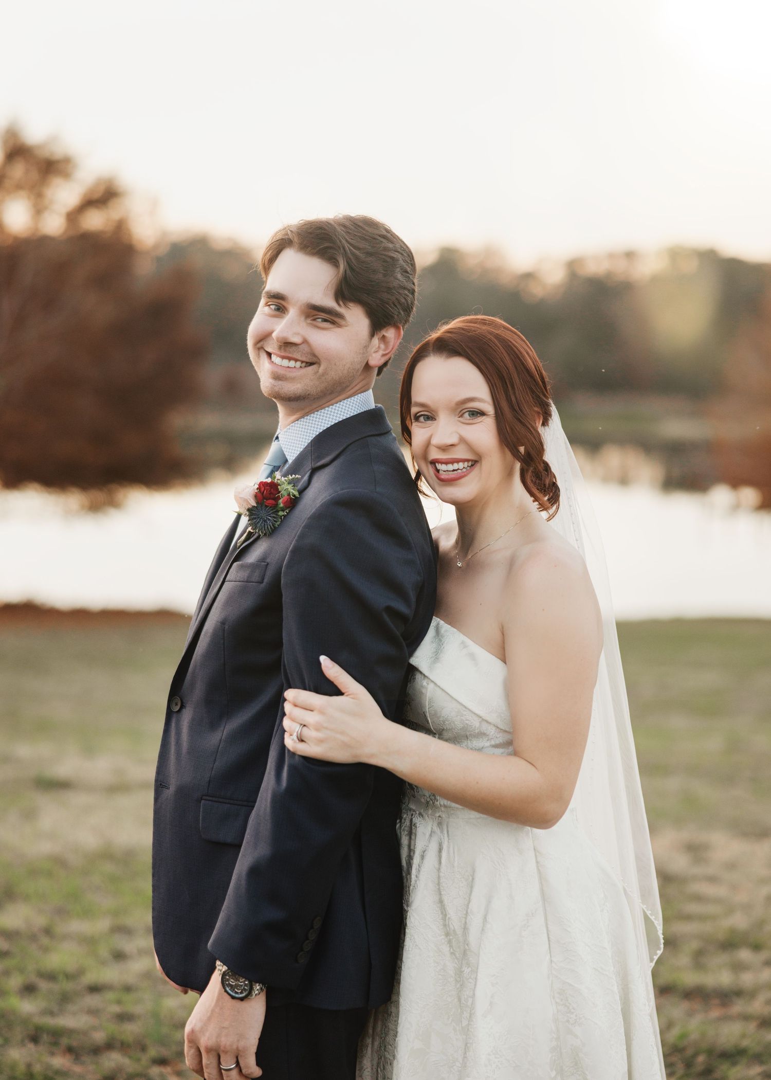 A couple shares joyful moments in a romantic outdoor photo session during golden hour at sunset.