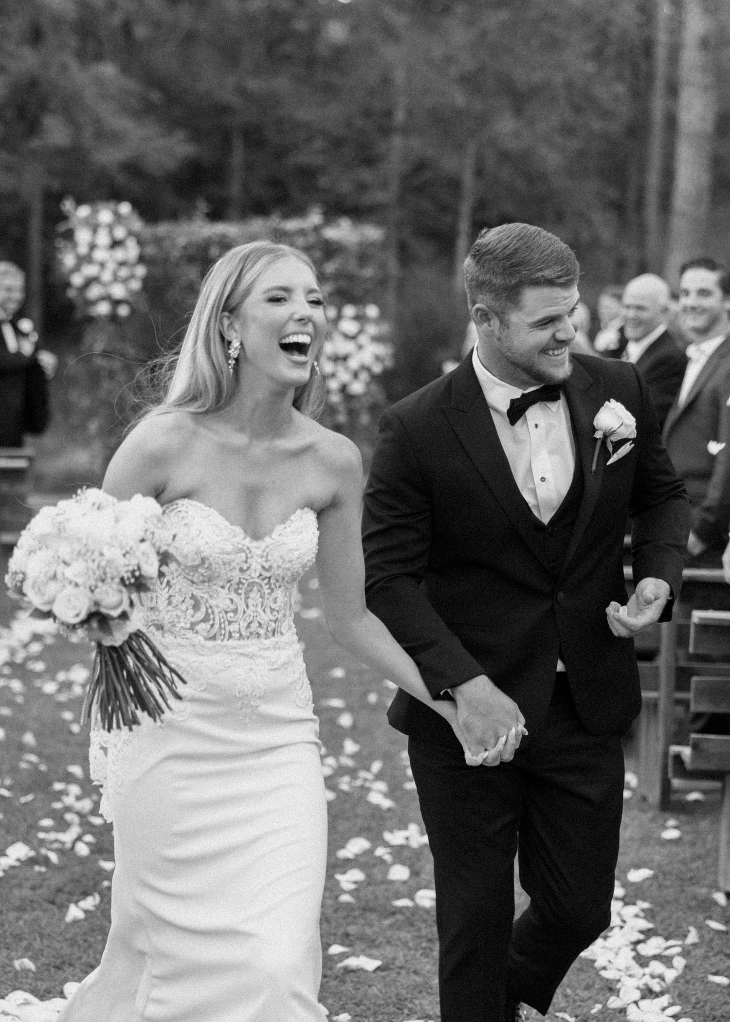 Four-photo sequence shows couple walking and dancing with flower petals falling around them at an outdoor wedding celebration.