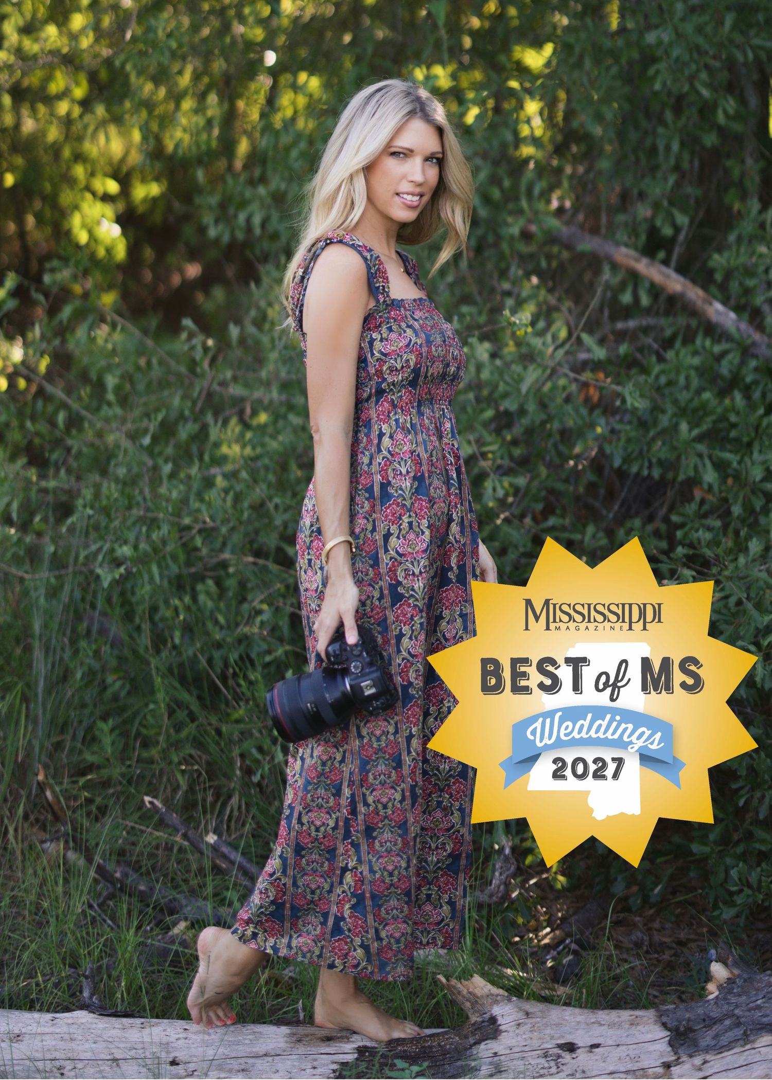 Blonde woman in floral maxi dress holding camera, Mississippi Best of MS Weddings 2027 award badge.