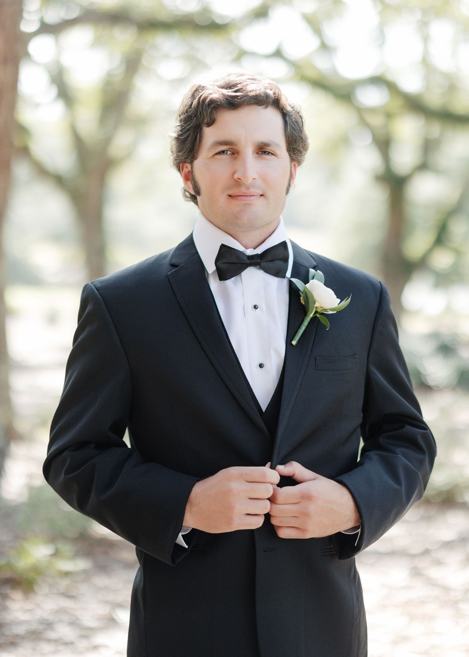 Series of photos showing groom adjusting bow tie and tuxedo jacket.