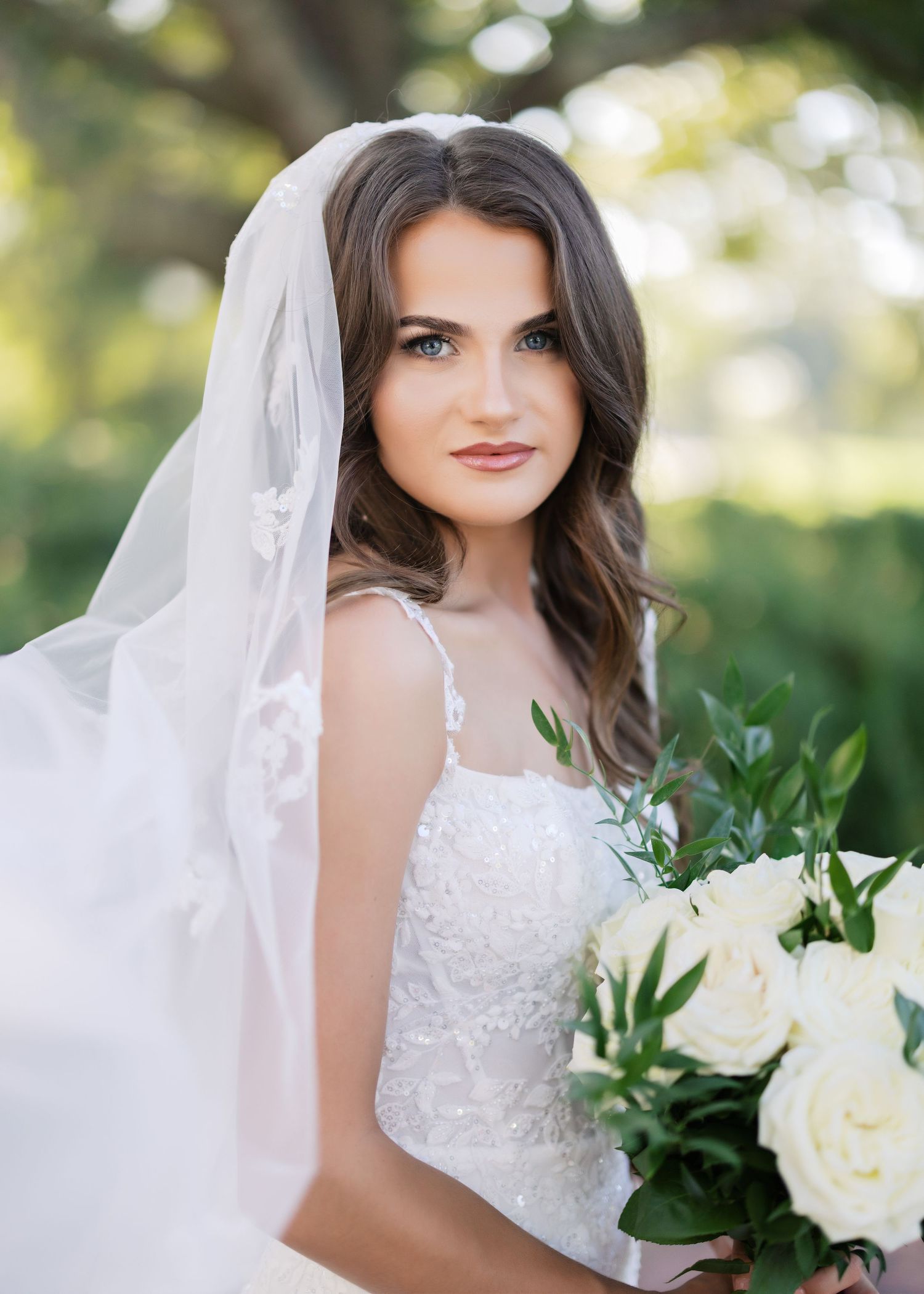 Wedding photography series showing white bridal gown and bouquet details in an outdoor garden setting.