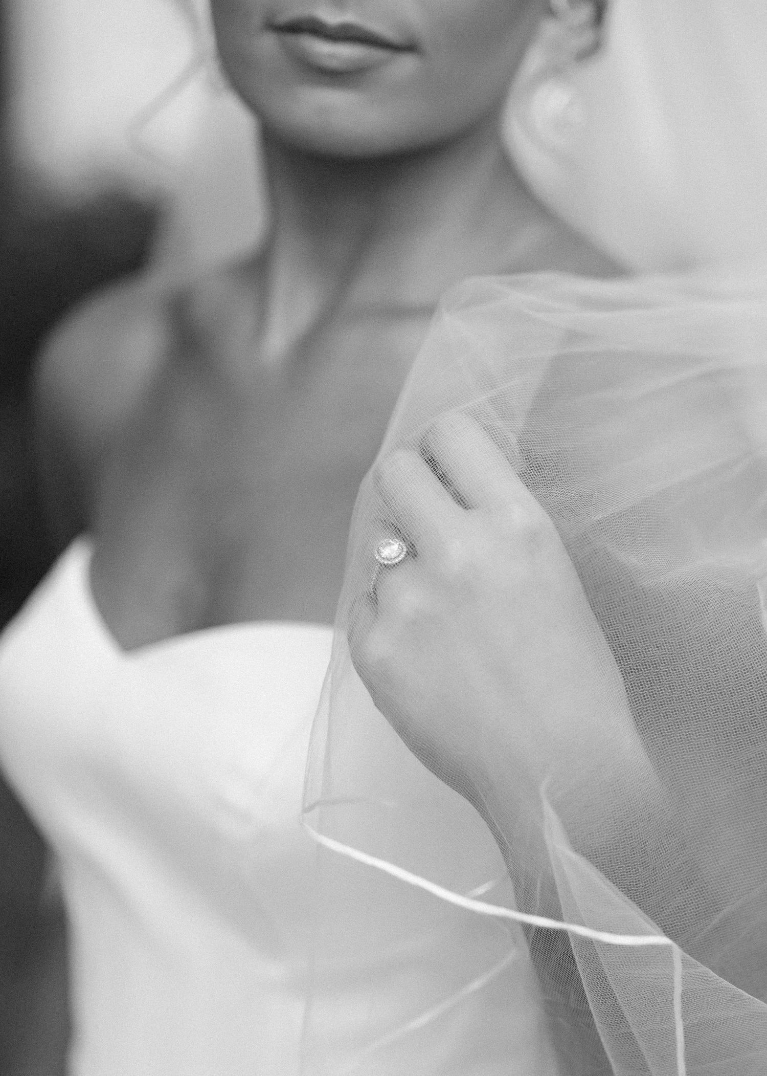 A black and white photo collage showing close-up details of a bride in a wedding veil and dress.