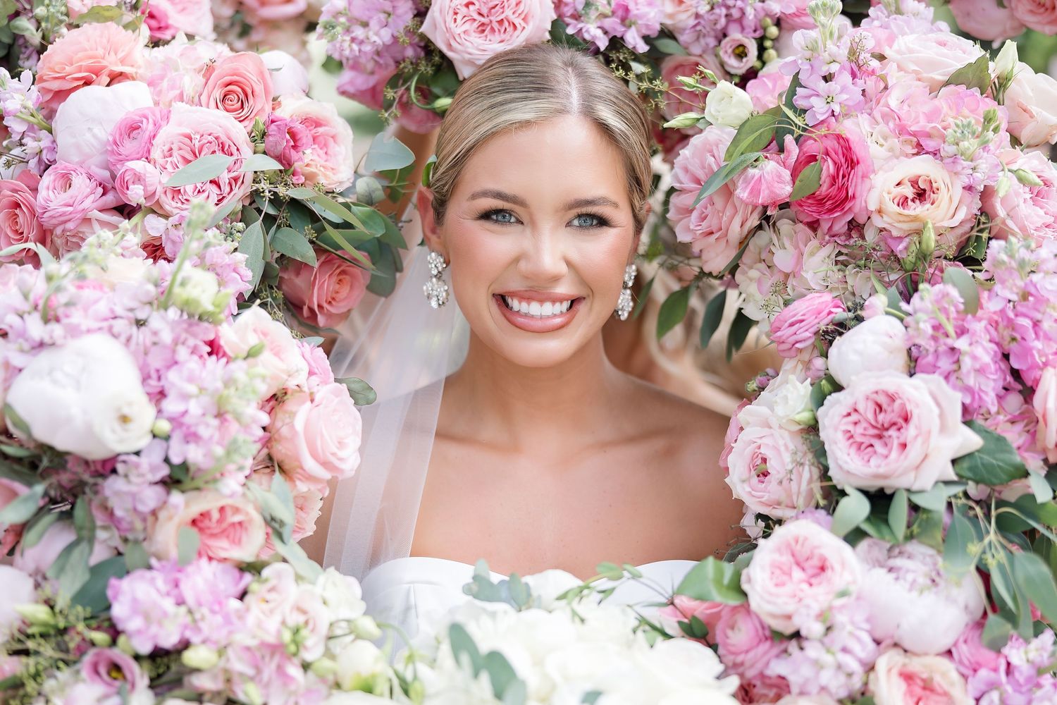 Romantic pink and white peony bouquets with lush floral arrangements.
