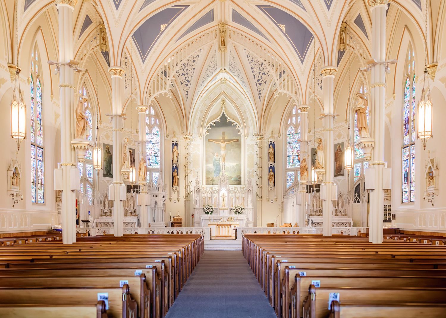 Gothic cathedral interior with vaulted ceilings and ornate architecture.