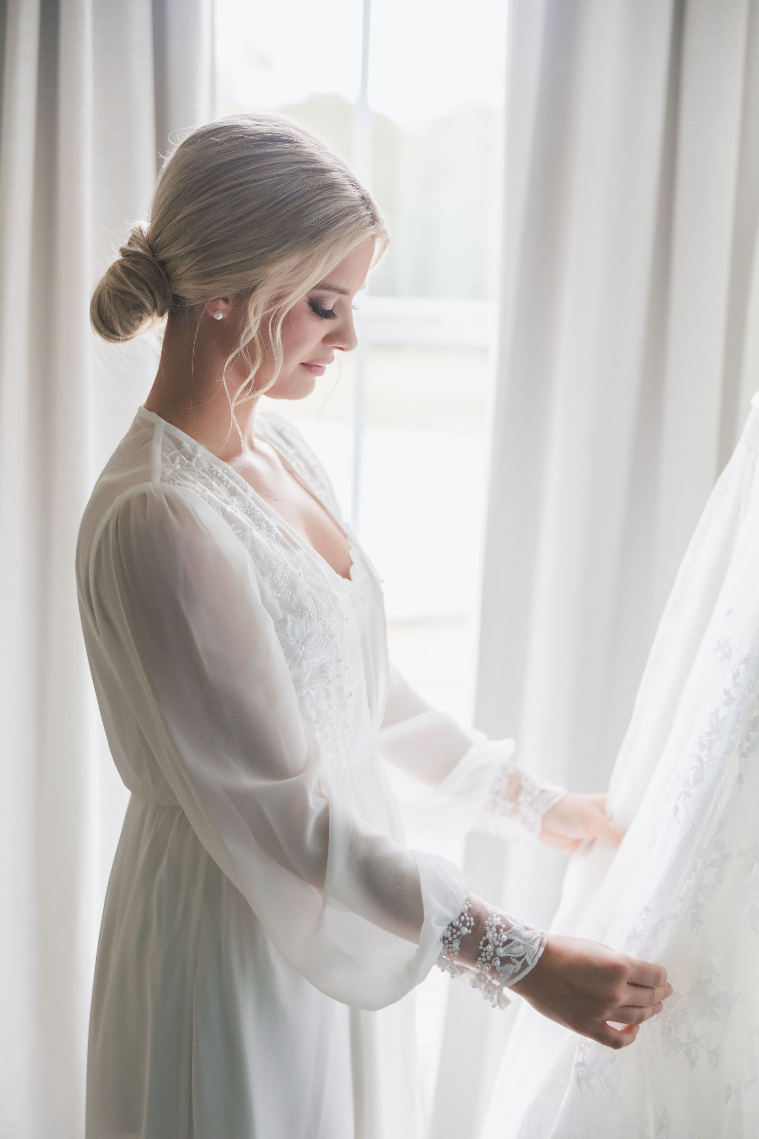 Black and white photos showing wedding dress details through sheer white curtains.