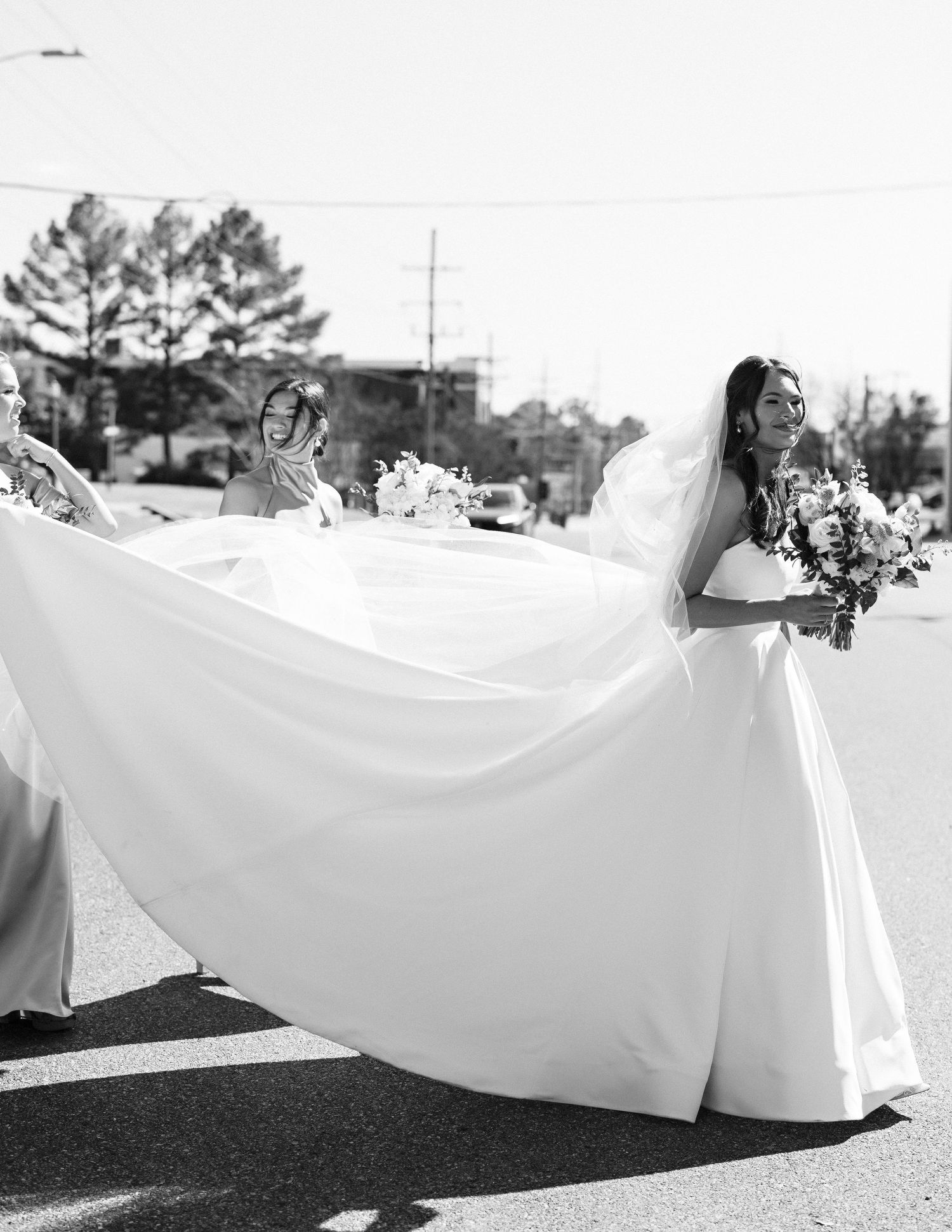 Black and white photo series of wedding dress train flowing dramatically across dark ground.