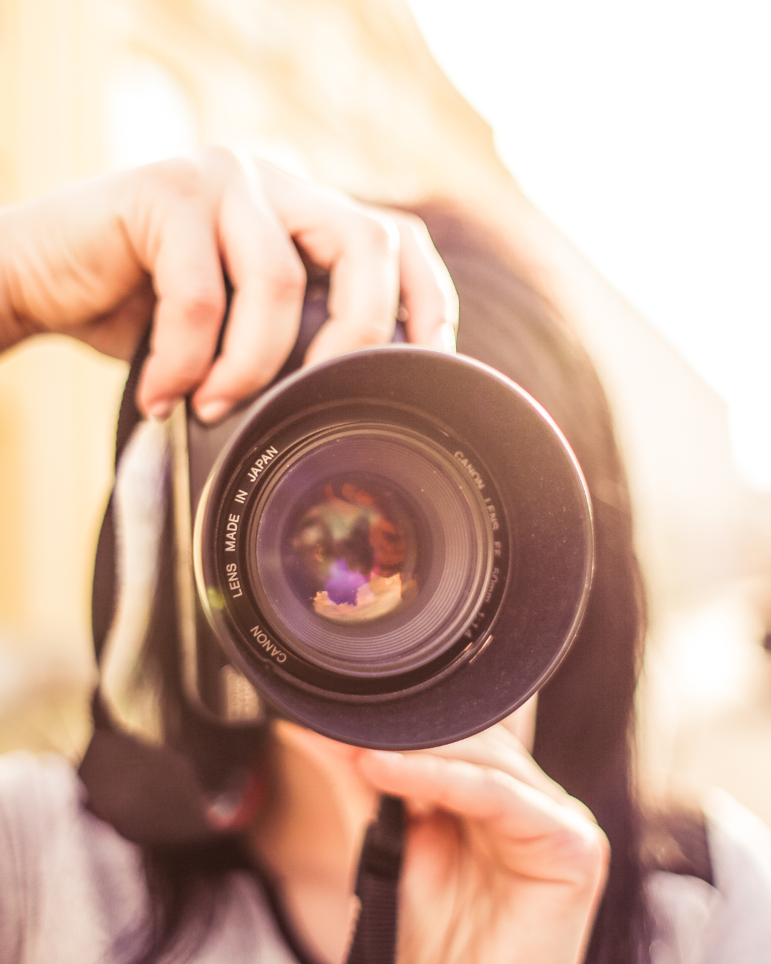 Close-up view of multiple camera lenses in soft focus creating an artistic photography composition.