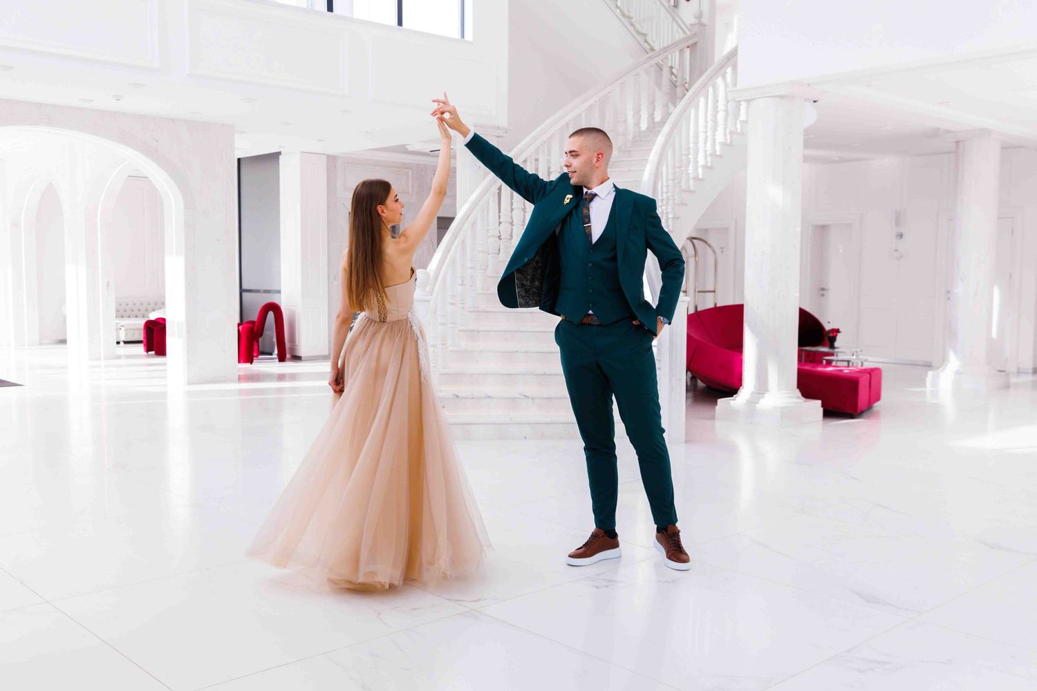 Collage of elegant wedding photos showing couple dancing in flowing gown and suit in bright white venue.