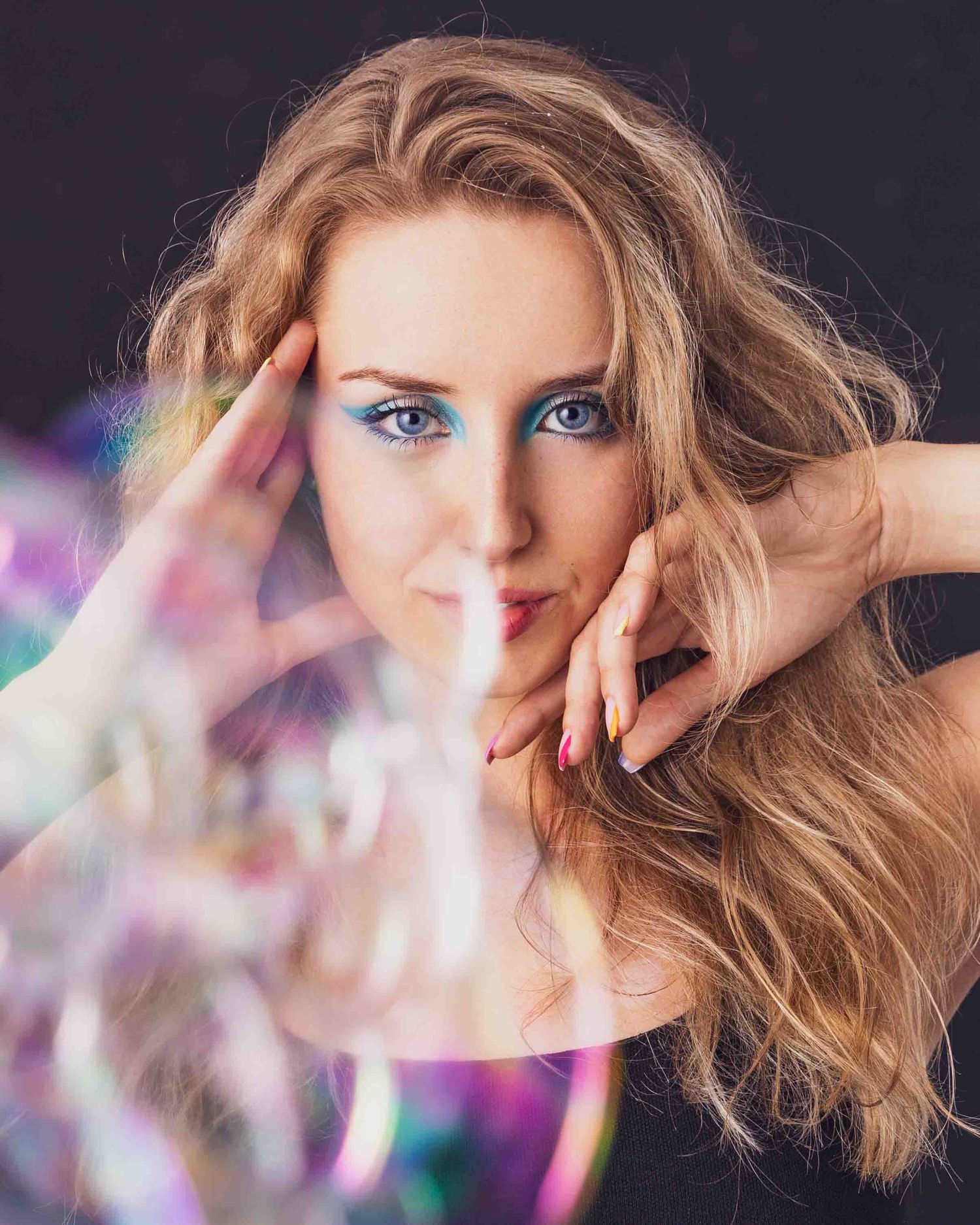 Artistic portrait with colorful light prisms and dreamy ethereal effect.