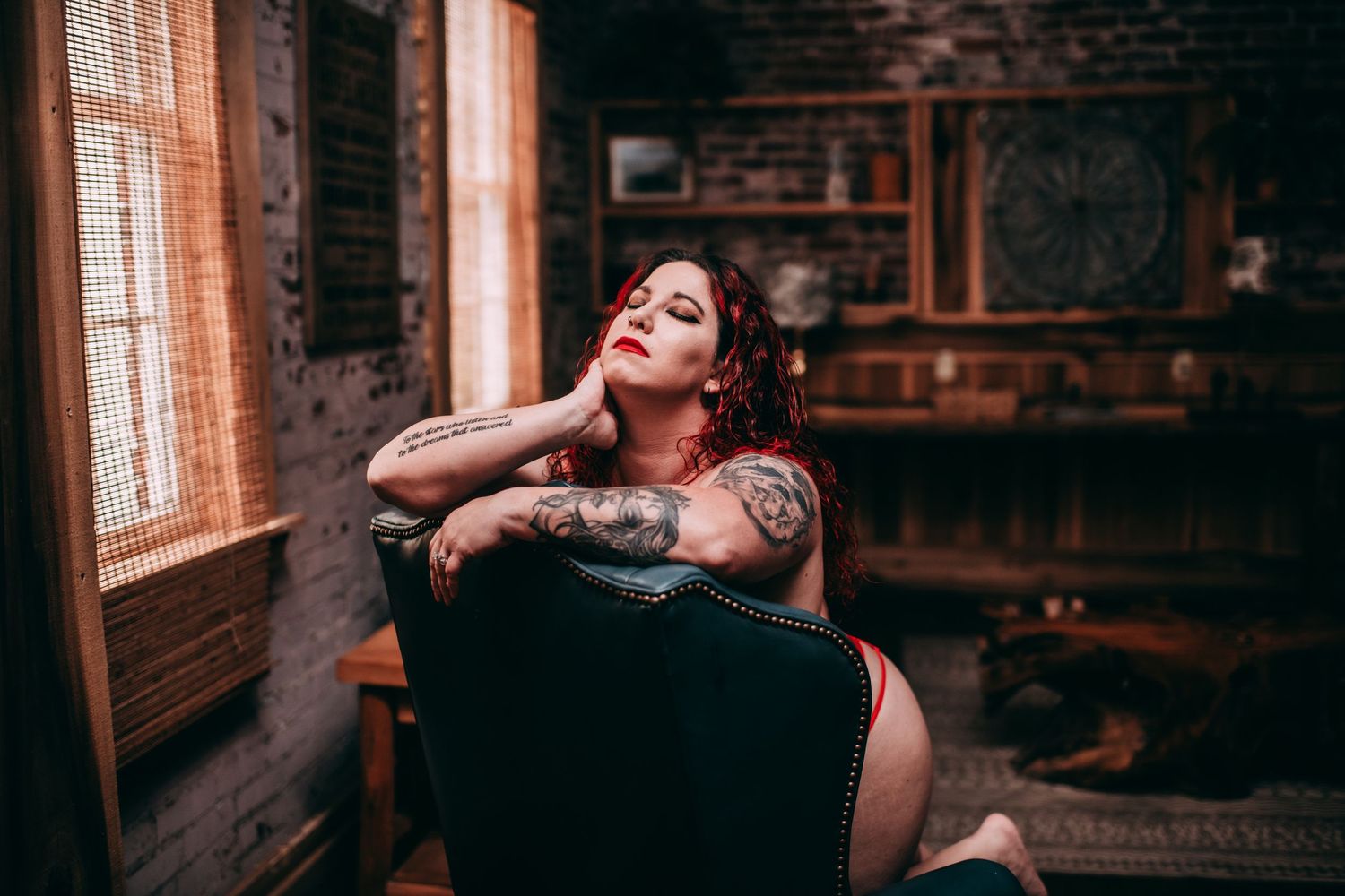 Moody interior scene with exposed brick walls and dramatic lighting. Vanceburg Ky