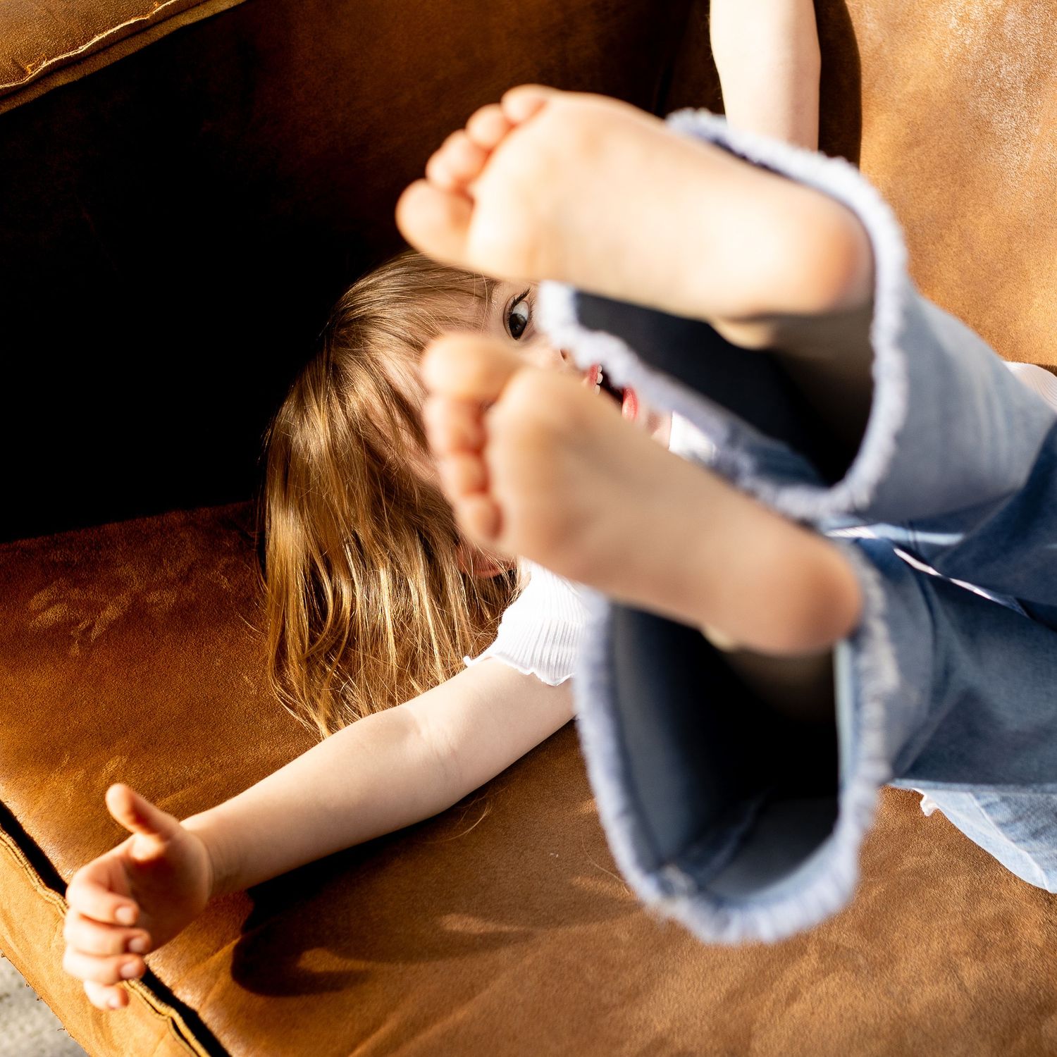A sequence of cropped images showing hands working with clay or dough on a wooden surface in warm lighting.