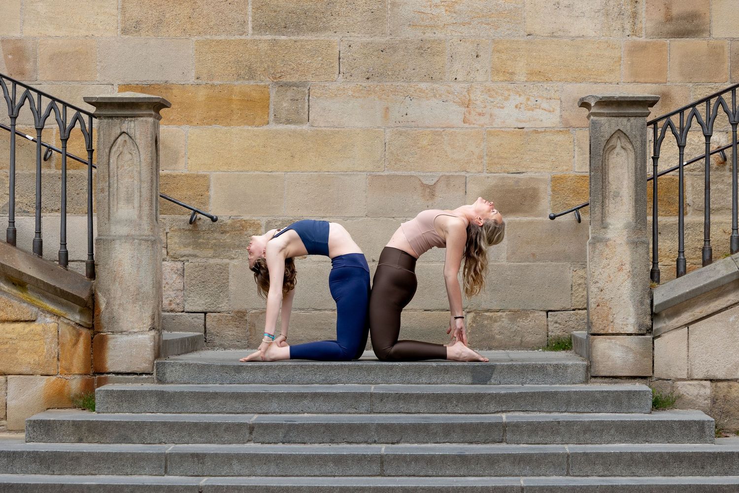 Yoga sequence performed on stone steps showing various stretching and balancing poses.