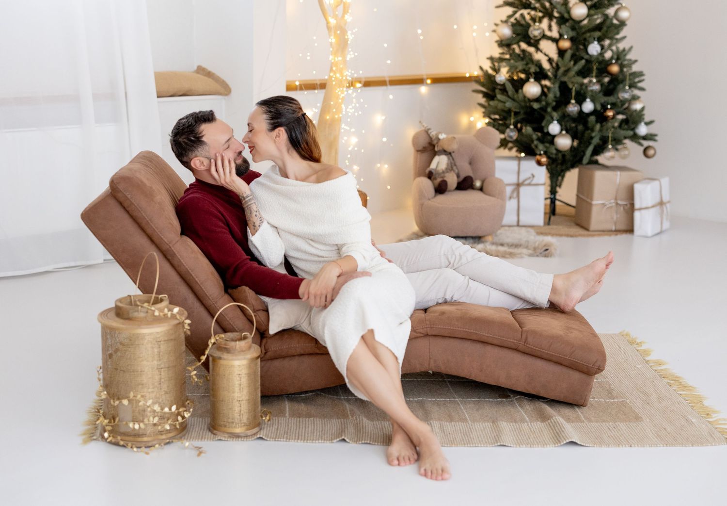Four connected Christmas themed indoor photos showing cozy festive scenes with a decorated tree and gold accents.