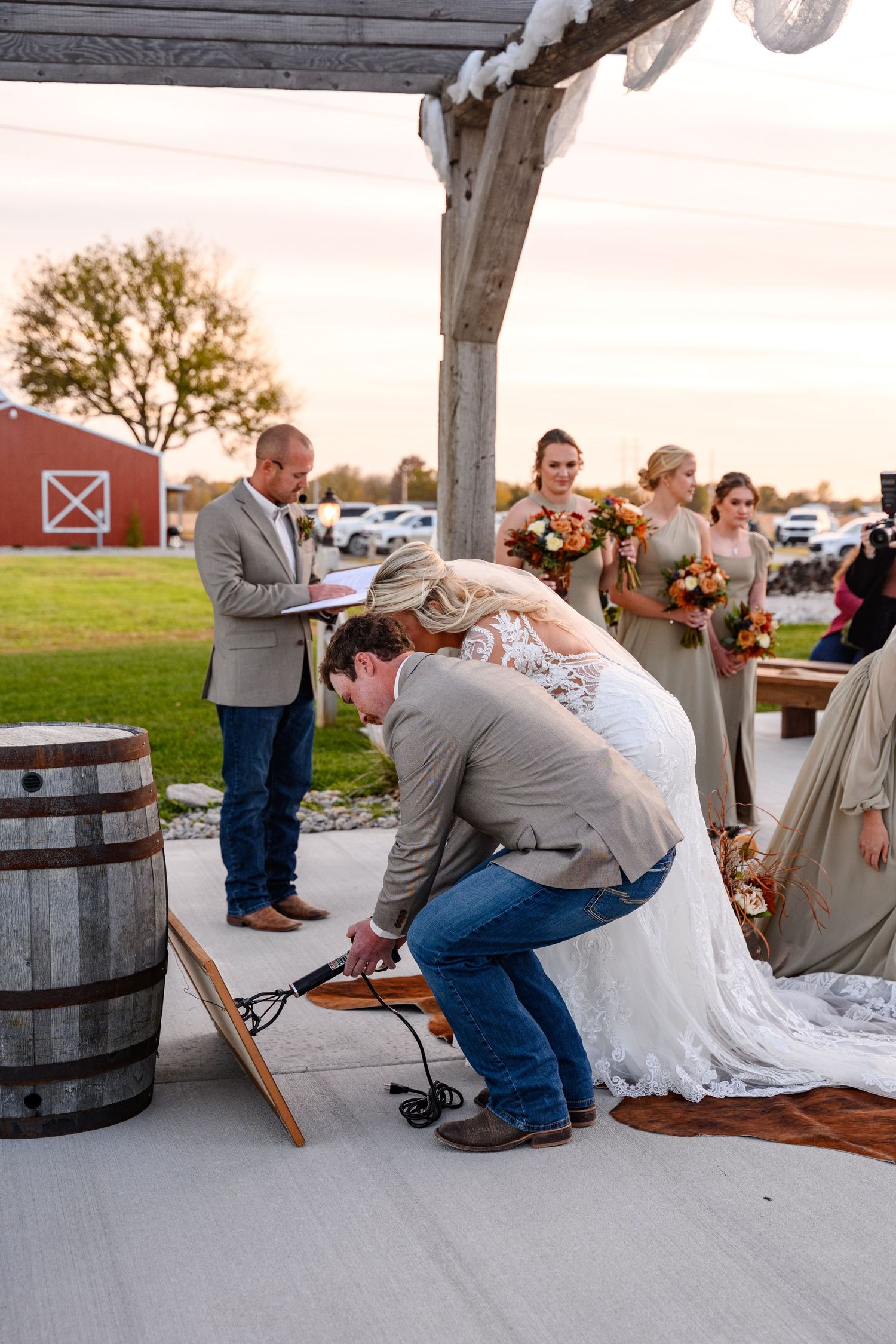 A couple performing a branding to unite their love for each other during their ceremony.