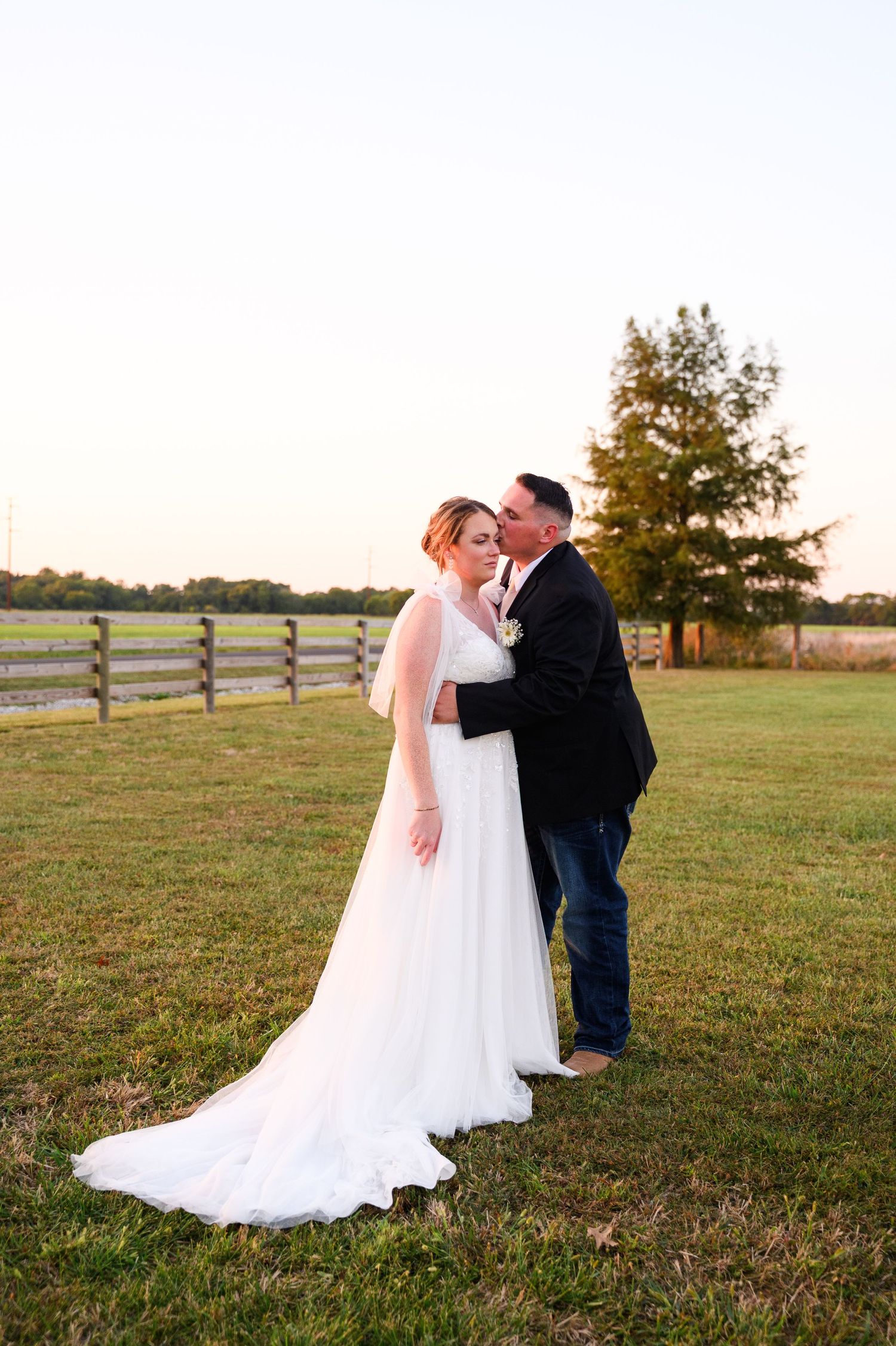 A couple in an open field at Camp 400 at sunset.